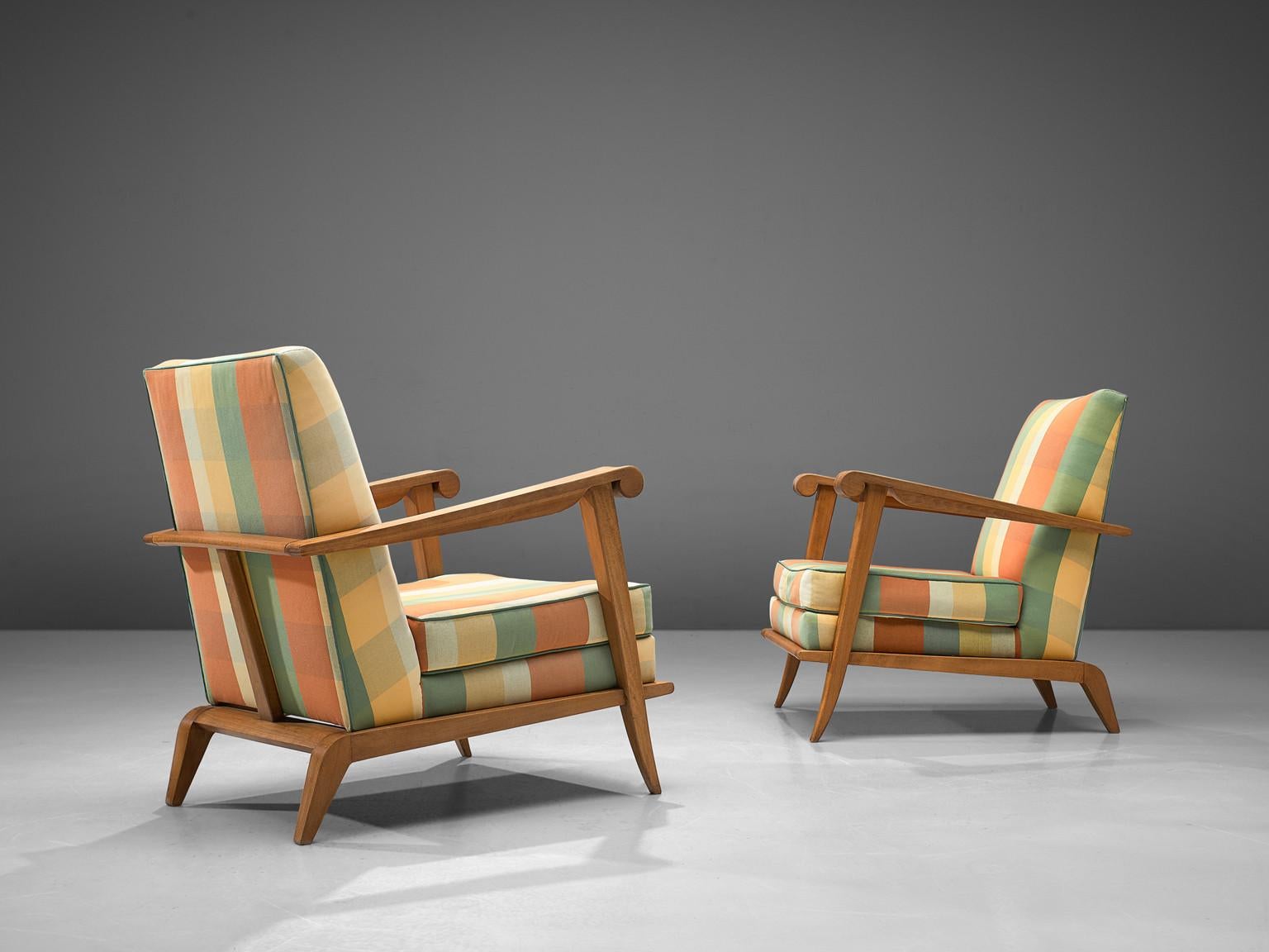 Pair of lounge chairs, oak, fabric, France, 1950s

Outstanding set of lounge chairs have a striped/ blocked upholstery with a solid oak sculptural frame. The chairs are finished with an additional cushion in the seat for extra comfort. The rounded