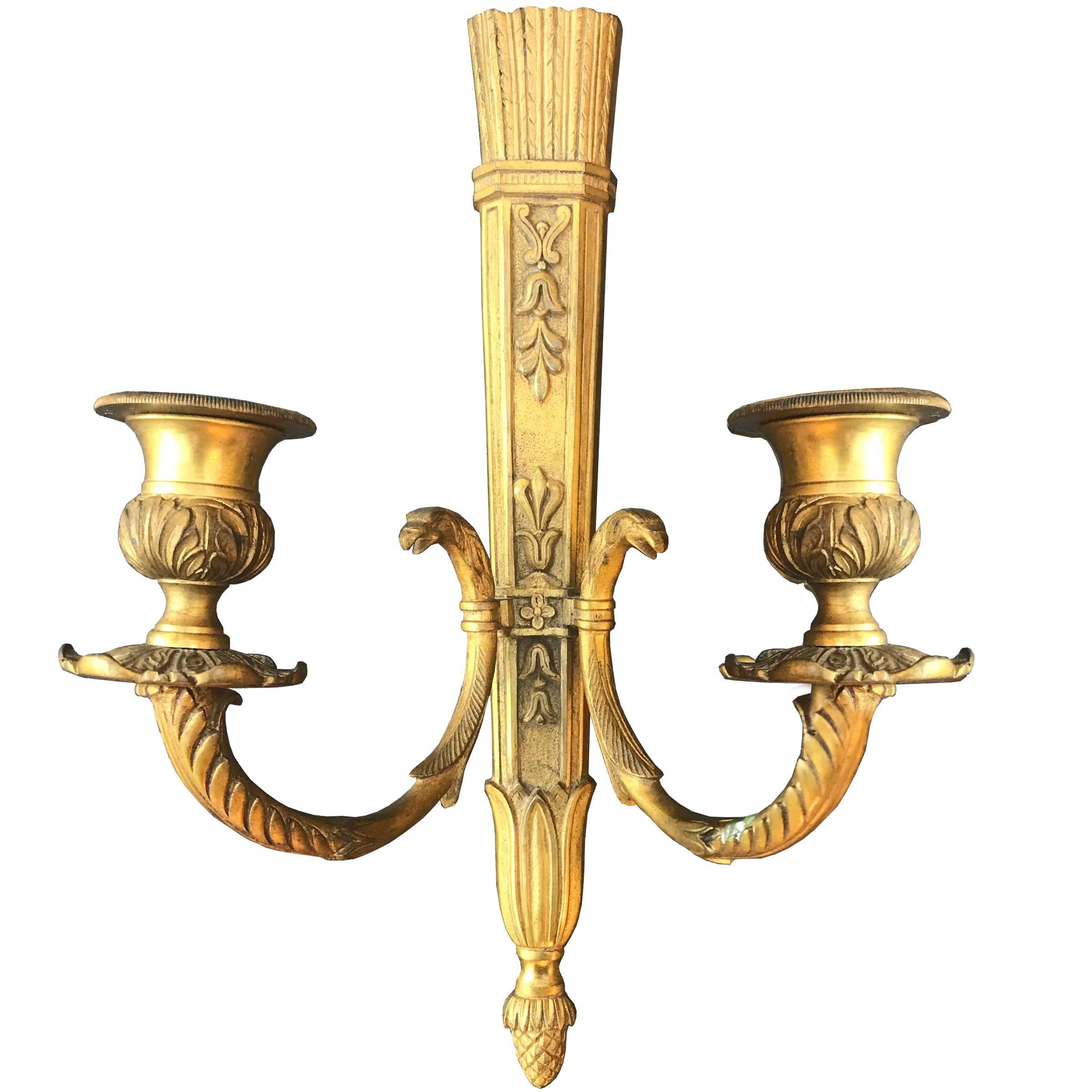 A pair of mid-19th century French second Empire gilt bronze candle scones with arrow quiver backplates, and two arms with eagle heads terminating in candle cups. This pair has never been electrified.