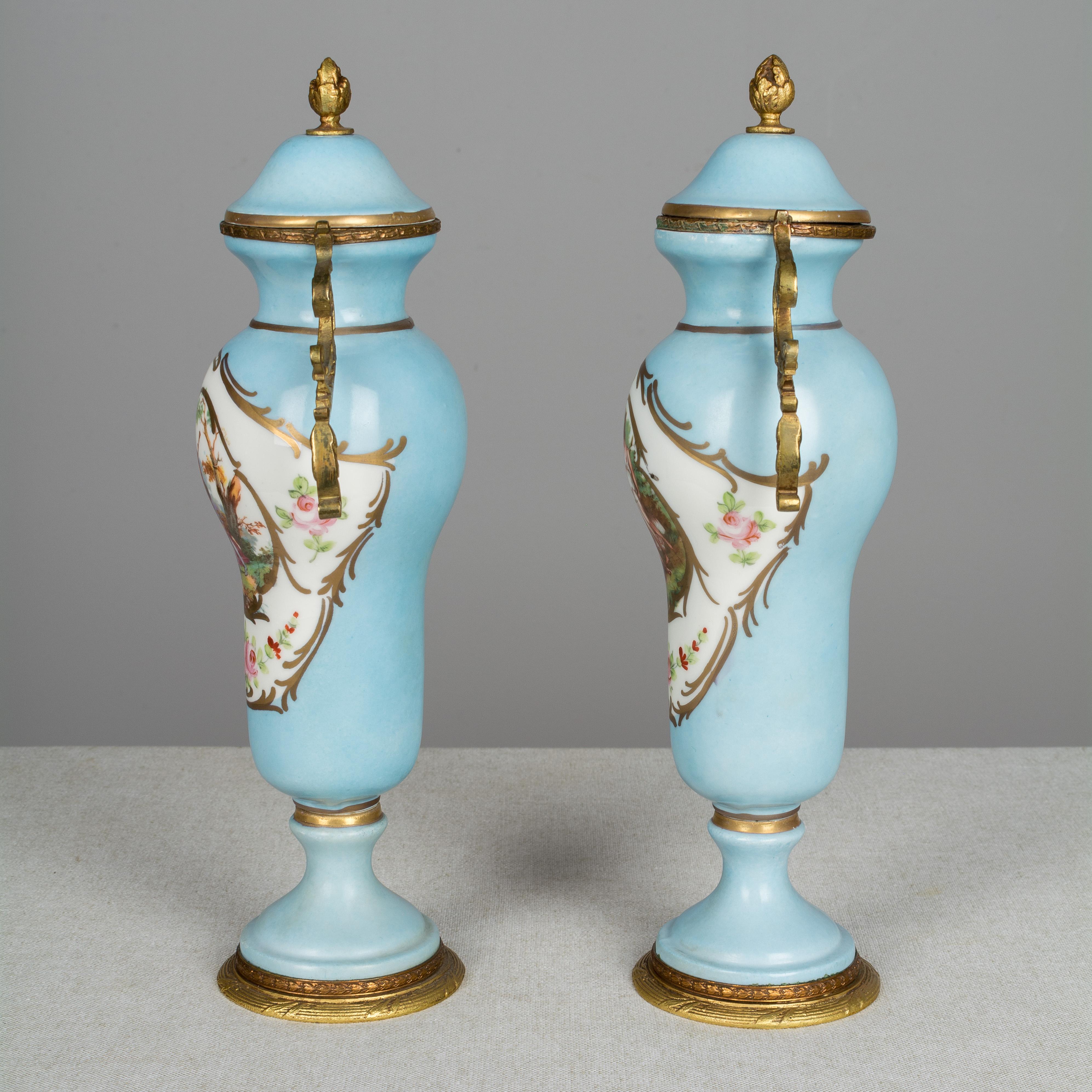 Cast Pair of French Sèvres Porcelain Urns