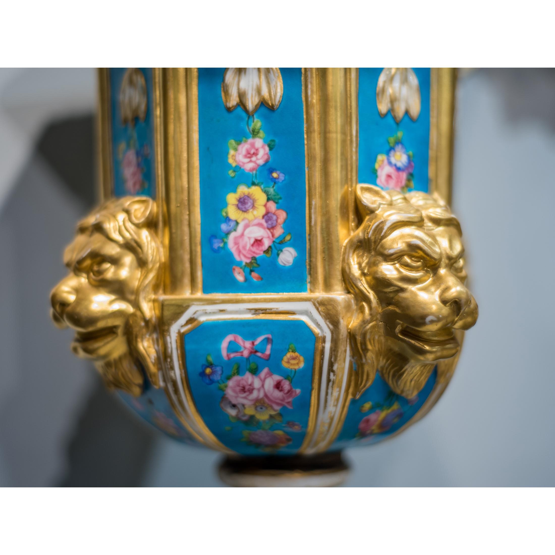 Pair of French Sèvres Style Gilded Porcelain Vases with Lion Heads In Good Condition For Sale In New York, NY
