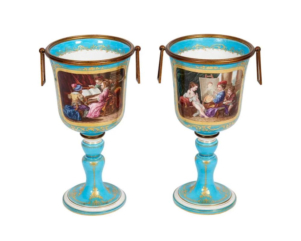 Pair of French Sevres style turquoise porcelain cups or vases hand-painted. 
Mounted with bronze handles. 
Extremely fine quality. 
Signed on the bottom. 
Measure: 9.5? high 5.5? wide 
Excellent condition. Normal wear.


 