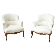 Pair of French shield back armchairs -carved frame