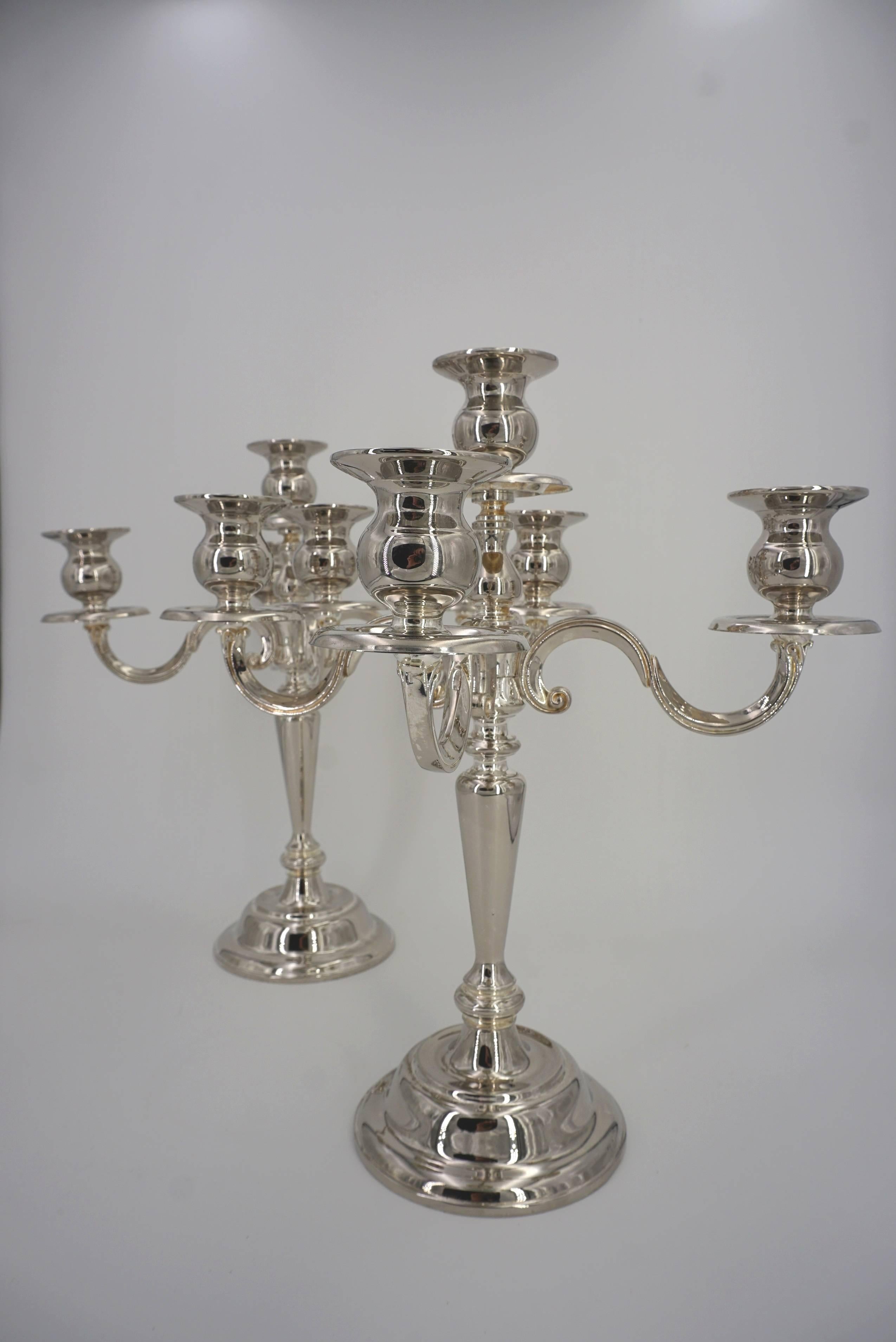 Pair of French silver candlesticks, brilliant and sparkling and in excellent condition.
