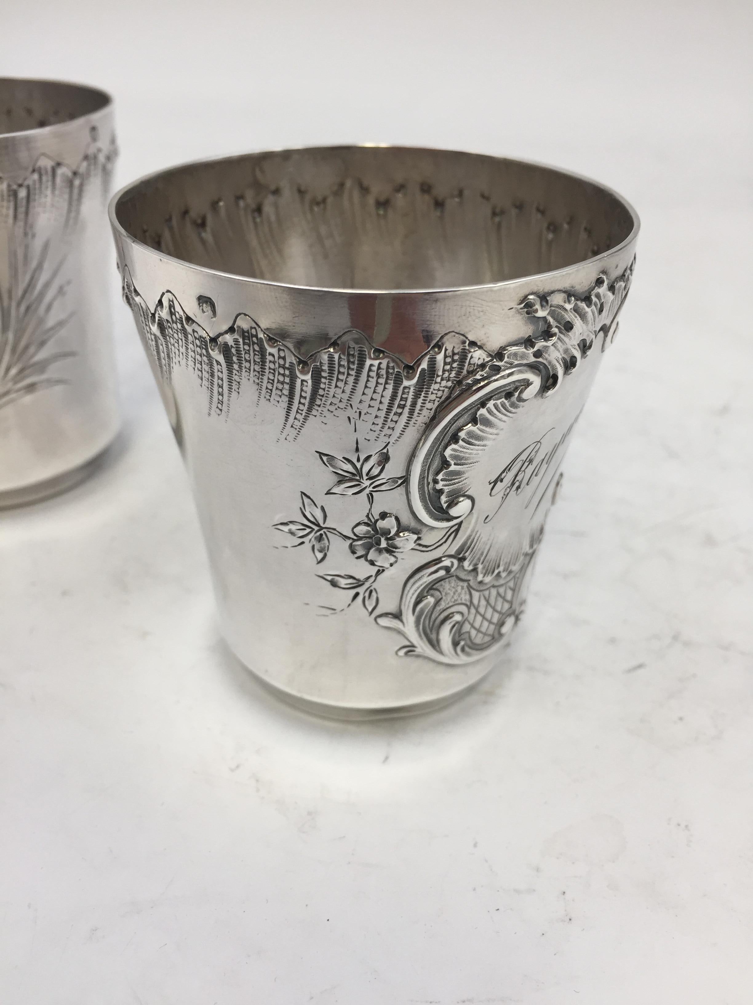 Pair of French silver Kiddush cups with ornate engravings and inscriptions measuring 2 3/4'' in diameter and weighing 4.7 ozt total. Just imagine how these cups would instantly elevate your table. Comes from the estate of the secretary of the Duke