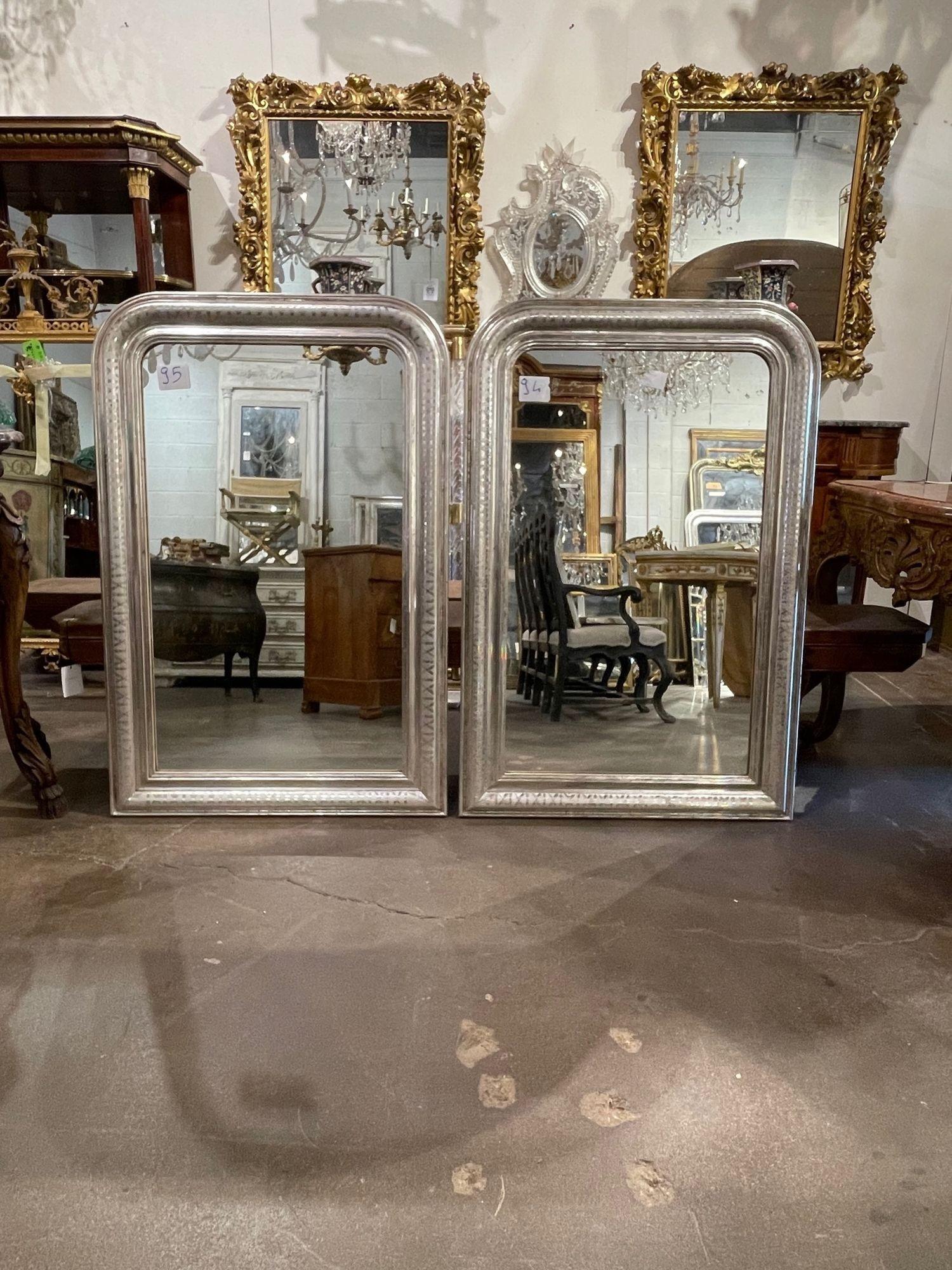 Fabulous pair of French Louis Philippe mirrors with decorative X pattern. Beautiful patina and nice clean lines. Perfect for a touch of elegance!
Circa 1940 47.5 H x 31.5 W.