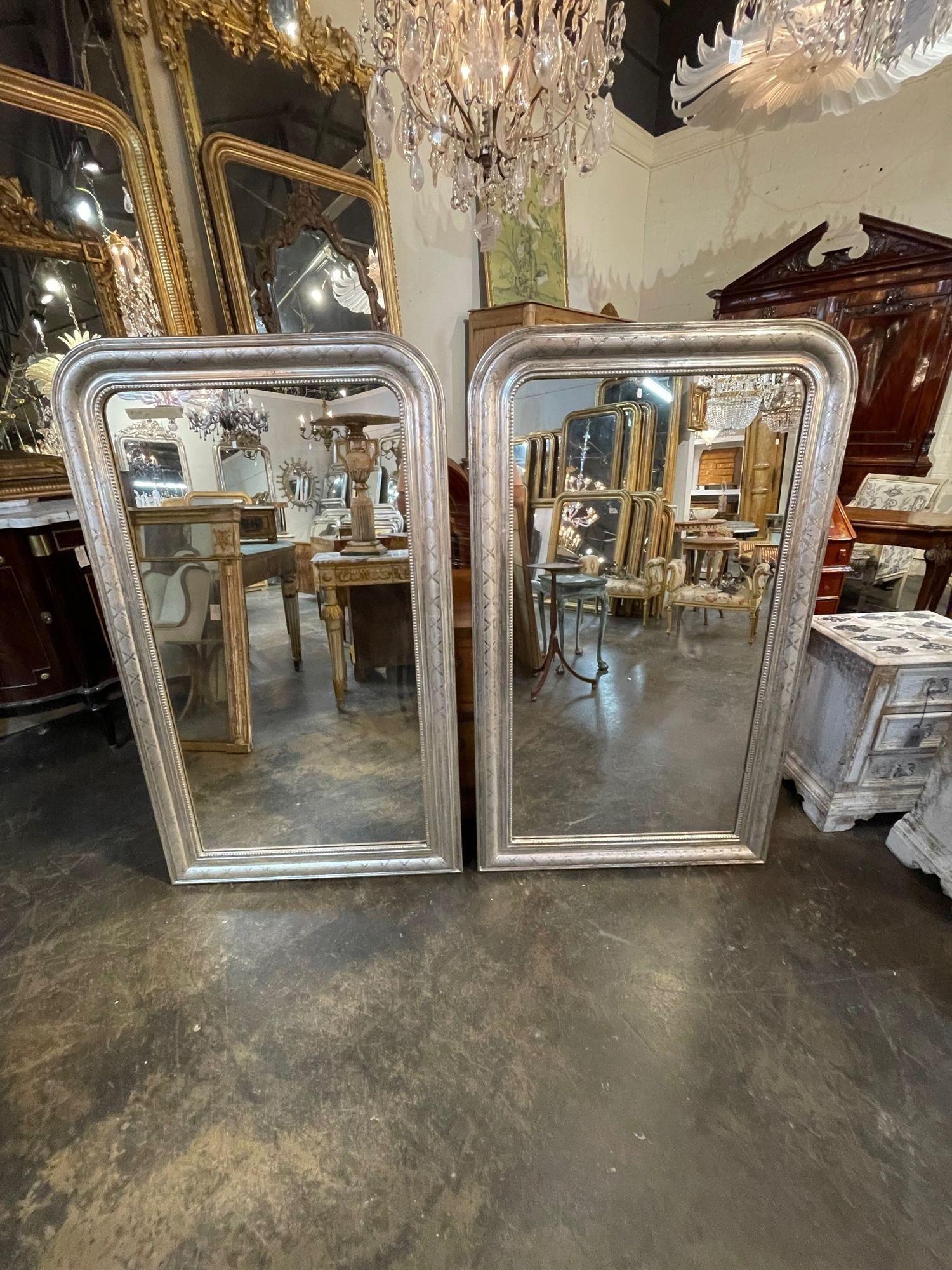 Exceptional pair of 19th century silver leaf Louis Philippe mirrors with X pattern. I very good conditional and also has a pretty beaded inner border. Superb!!