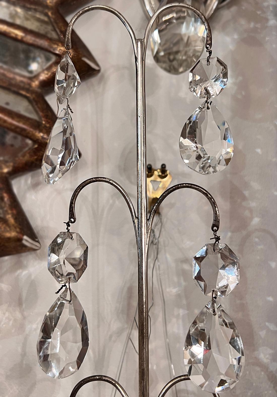 Pair of 1920's French sconces with crystal pendants.

Measurements:
Height: 18