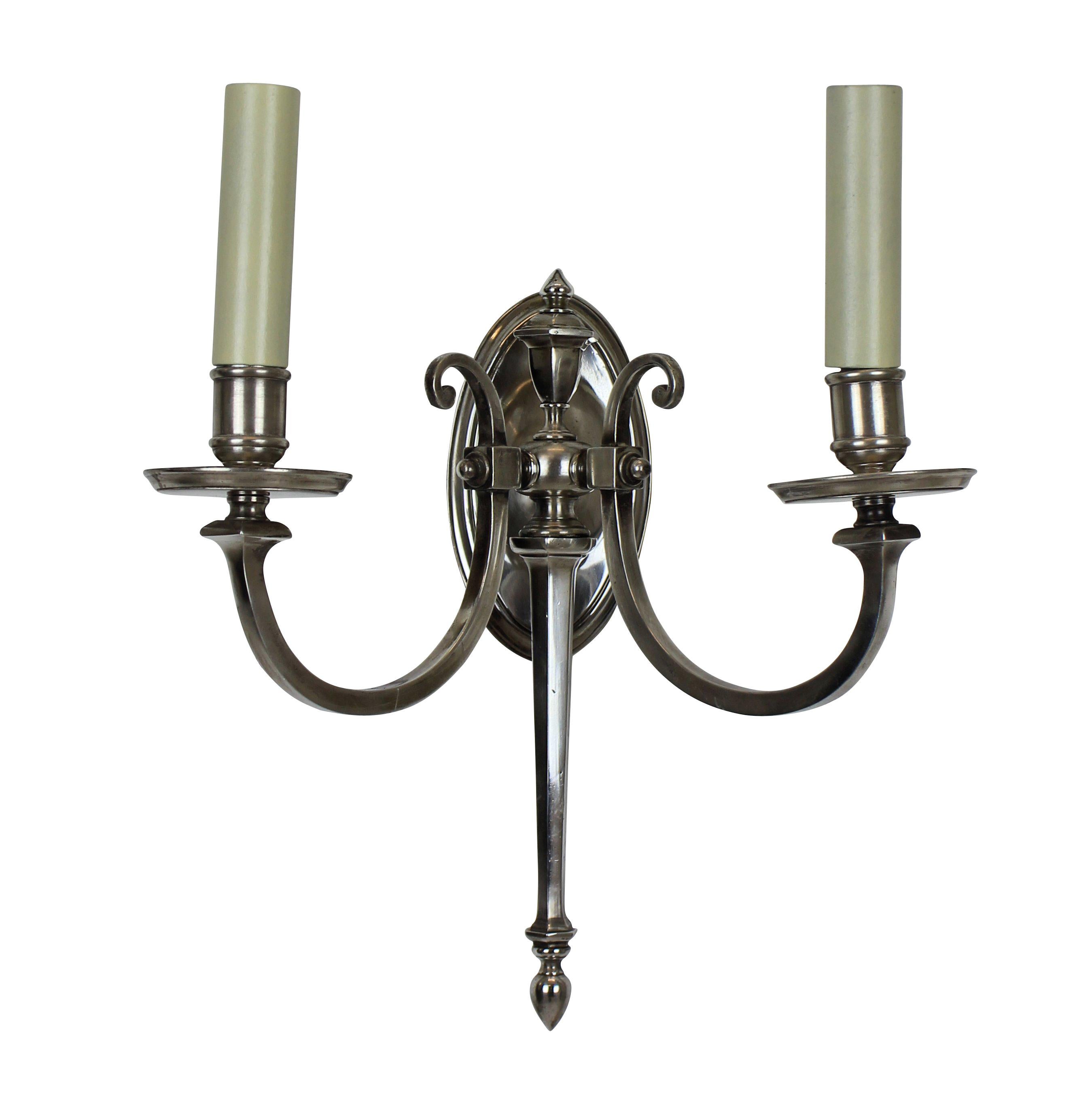 A pair of French silver plated twin branch wall sconces.