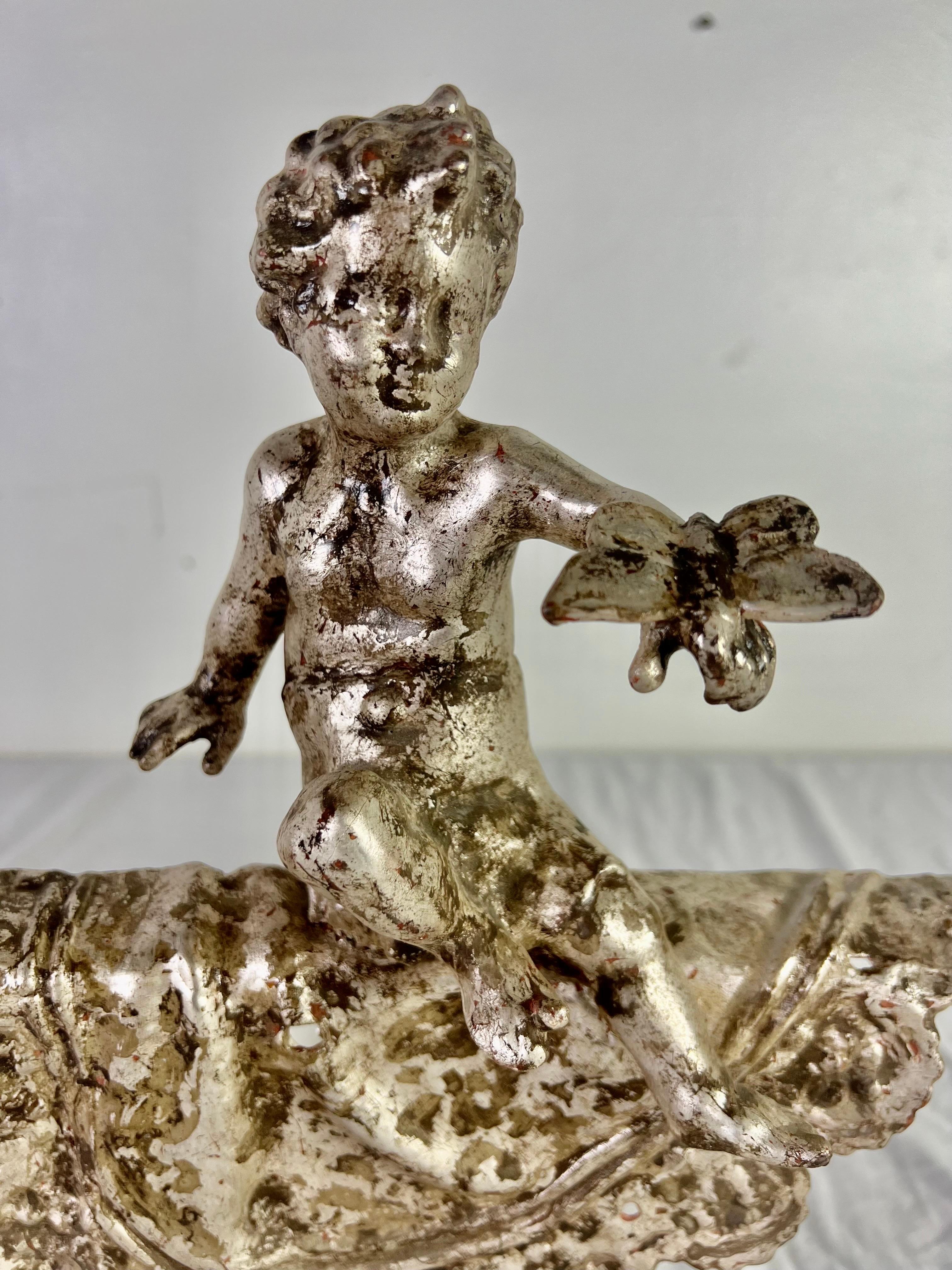 Pair of French Silvered Gilt Metal Cherubs on Lucite Bases In Excellent Condition For Sale In Los Angeles, CA