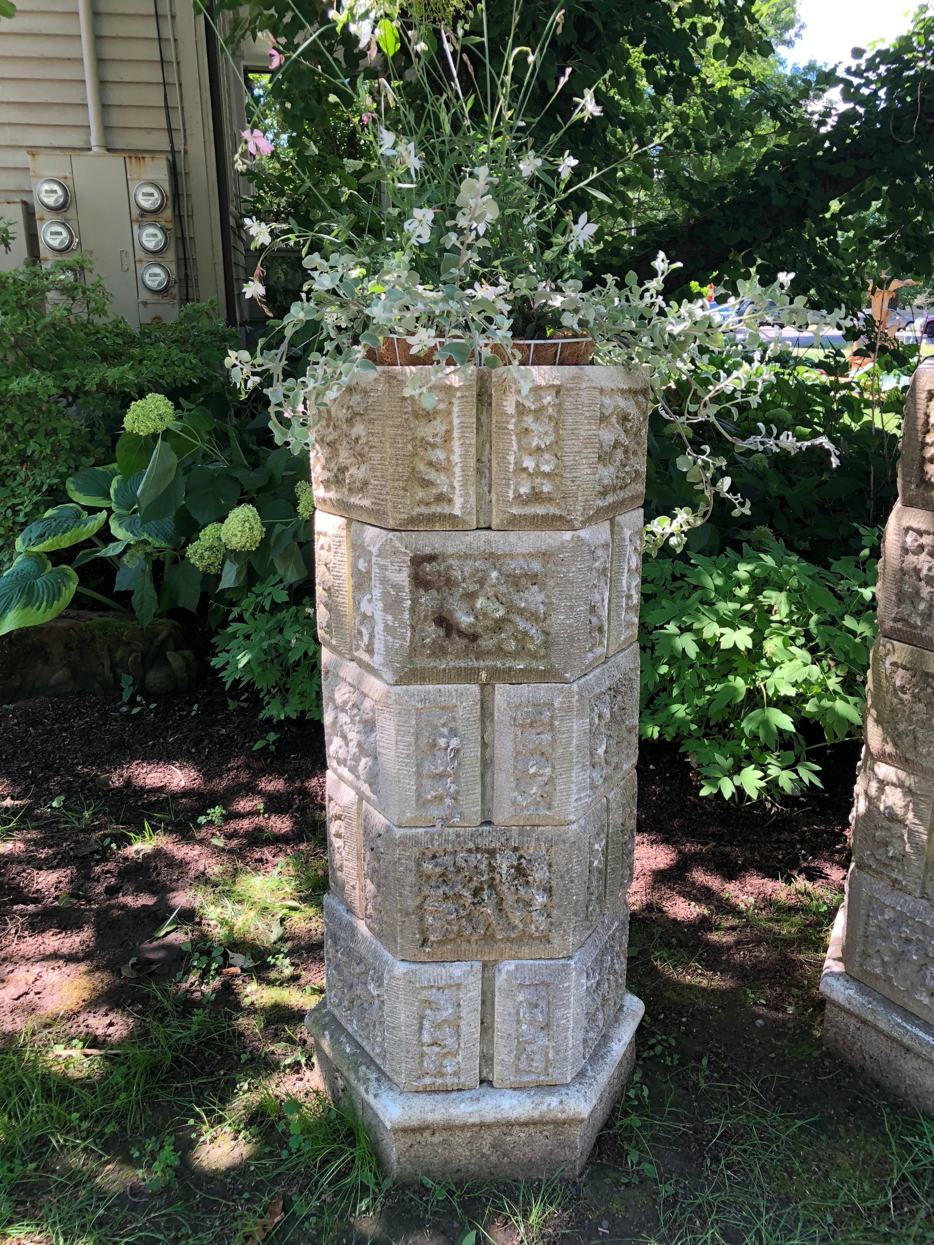 This pair of stackable cast stone planters has six tiers so you can use all six or remove one or two to achieve your desired height. Unusual in form and style, they would be the perfect accompaniment to a Tudor or Gothic Revival home or garden.