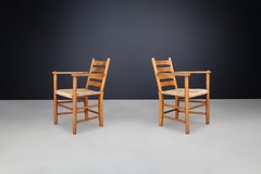 Paire de fauteuils à dossier en échelle en hêtre massif avec sièges en jonc, France, années 1950