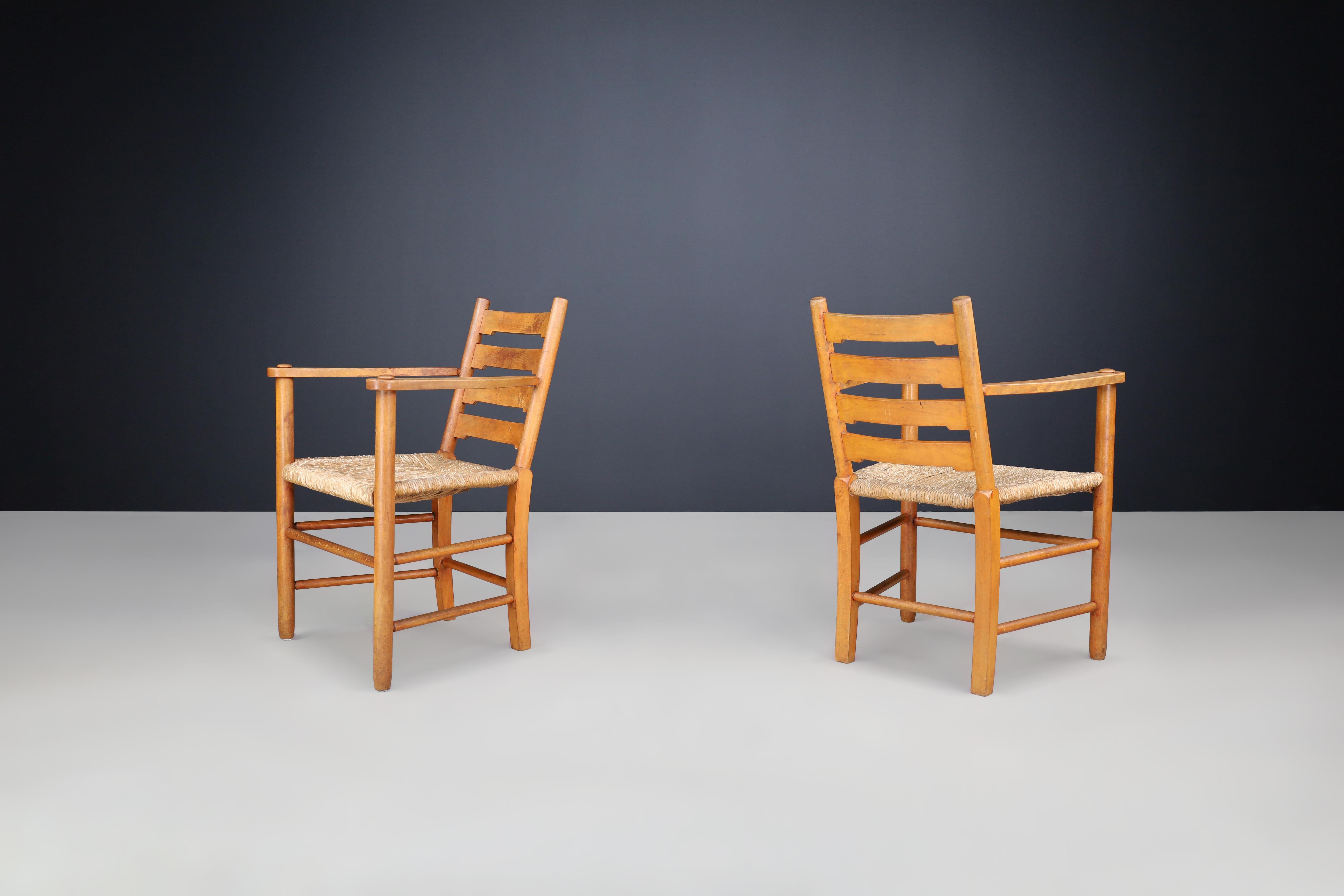 Mid-Century Modern Pair of French Solid Beech Ladder-Back Armchairs with Rush Seats, France, 1950s For Sale