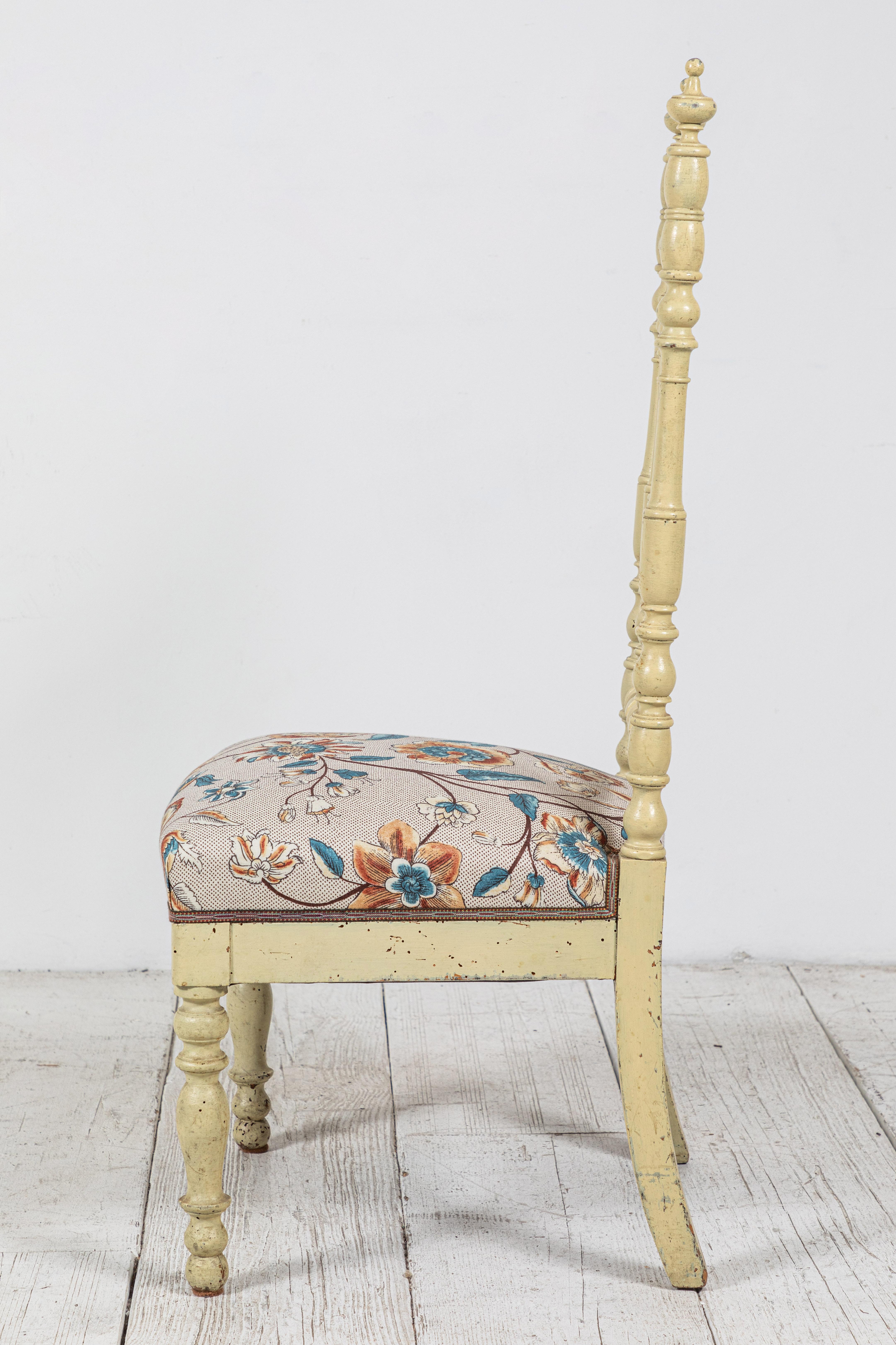 Early 20th Century Pair of French Spindle Side Chairs with Floral Seat Cushion