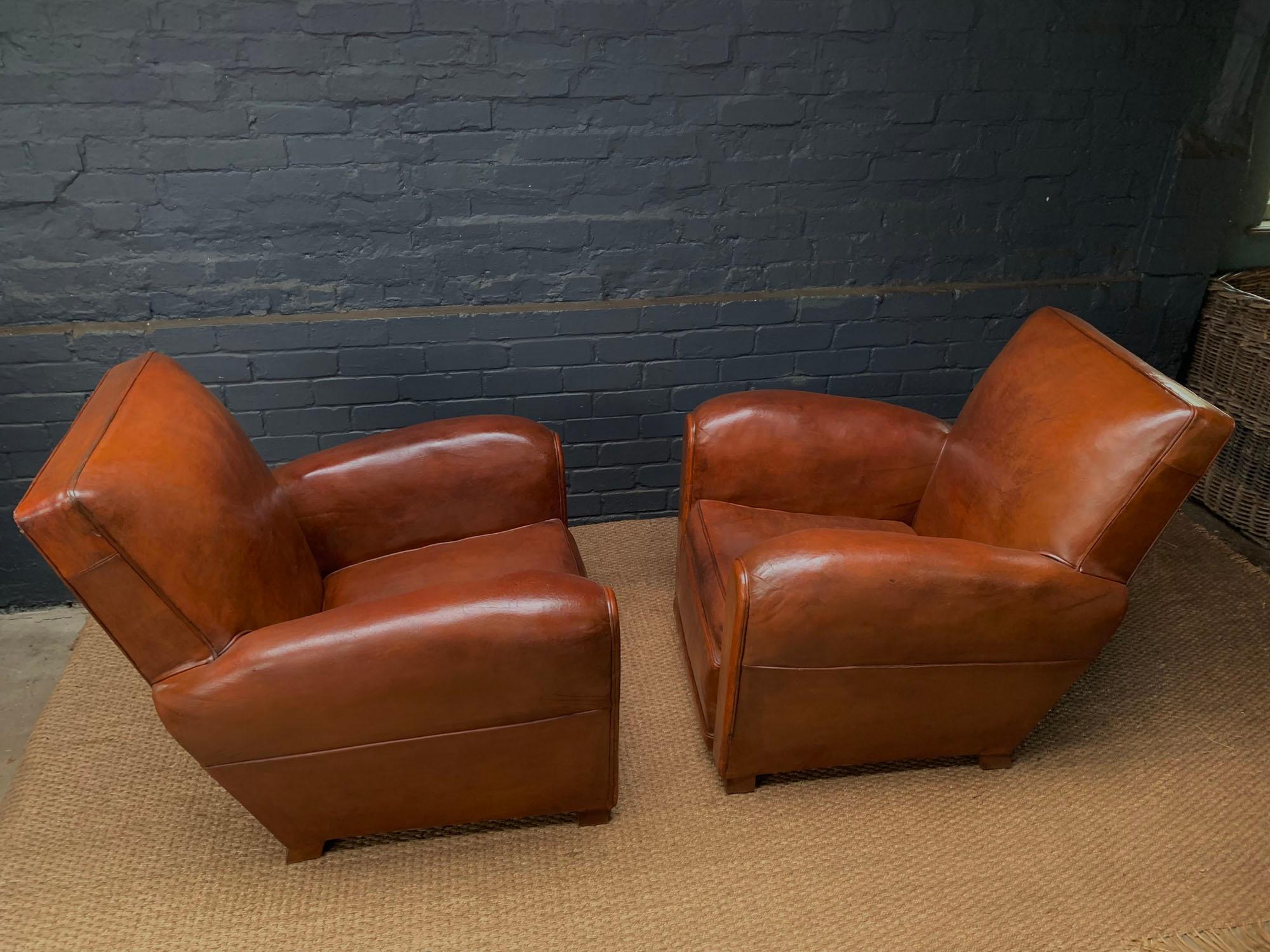 FRENCH LEATHER CLUB CHAIRS 
A classic pair of French leather club chairs produced in France in the 1920s, good strong original leather has been treated and strengthen using conditioner and oils, these chairs are in great condition with very minimal