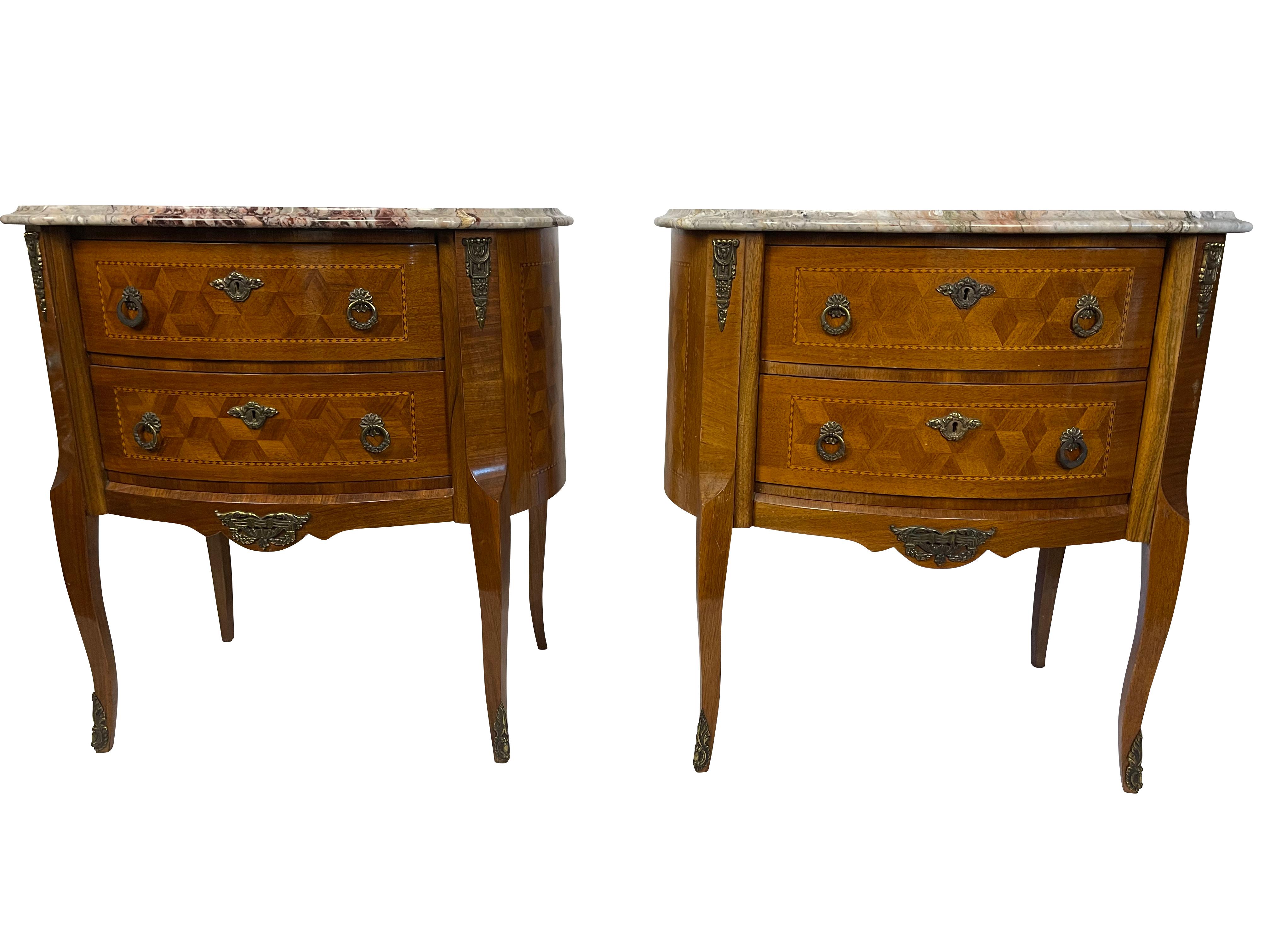 Pair of French Louis XV marquetry bedroom side tables with beautiful ormolu mounts, marquetry inlay, original key, and grey veined marble tops. Made in Yugoslavia 1940-1950 in excellent condition. Very nice larger size as bedroom side tables or in a