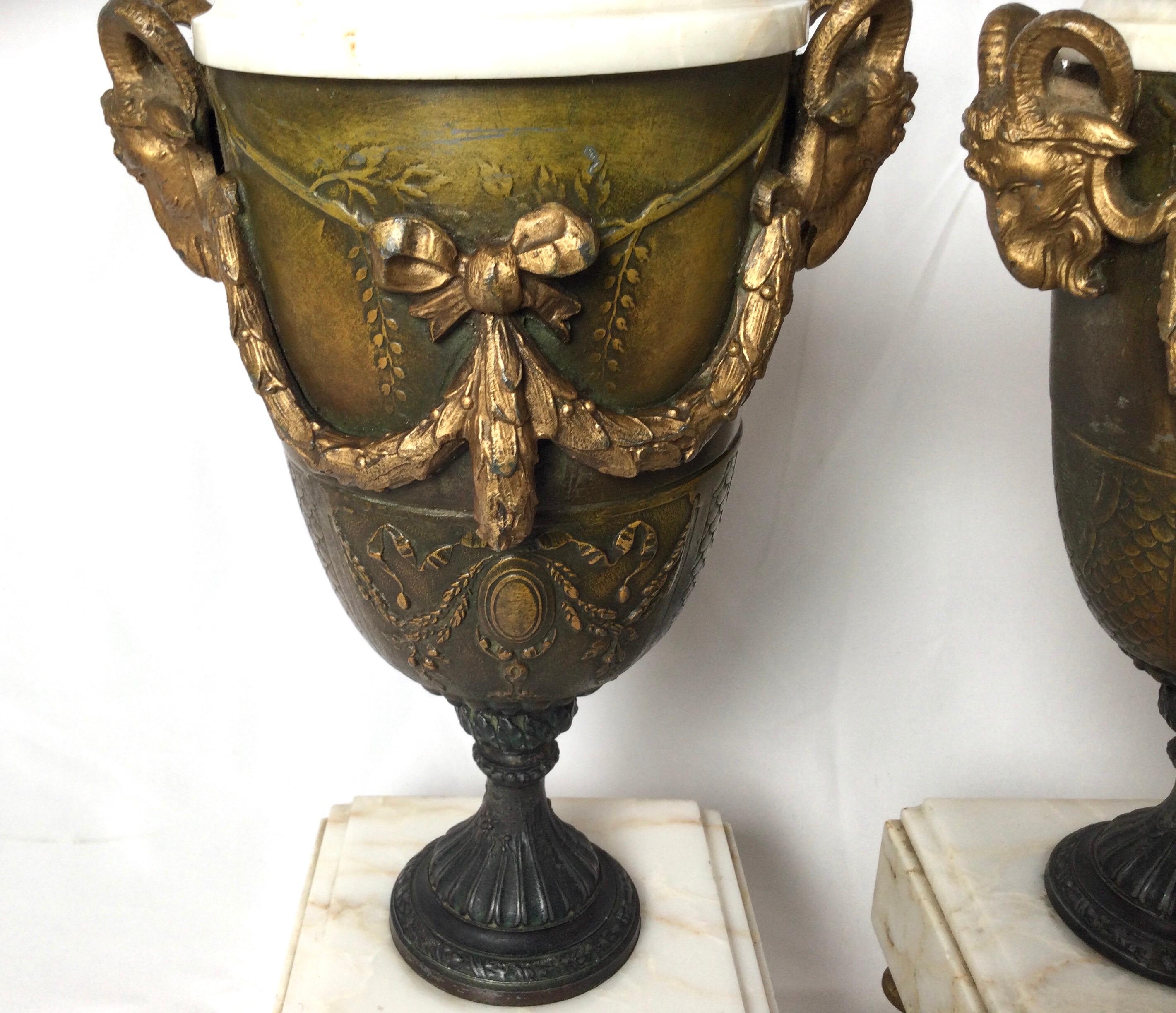European Pair of French Style Marble and Patinated Metal Garniture Urns with Rams Heads For Sale