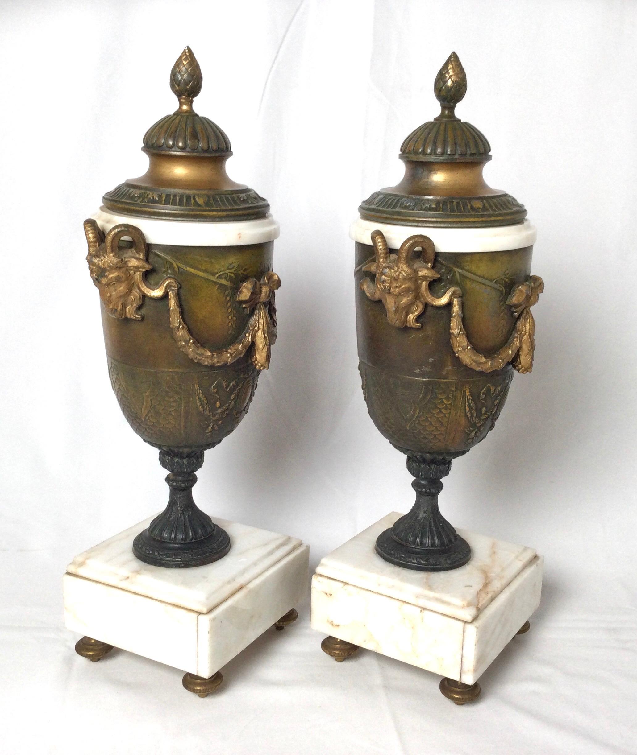 Pair of French Style Marble and Patinated Metal Garniture Urns with Rams Heads In Good Condition For Sale In Lambertville, NJ