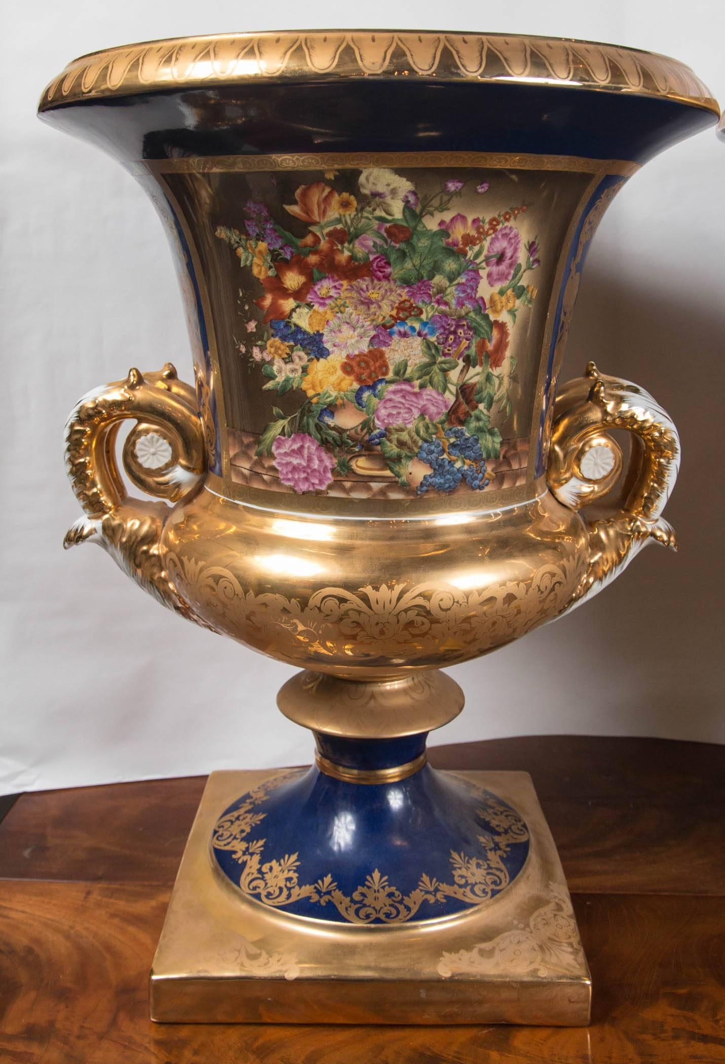 Pair of French Style Painted and Gilded Porcelain Classical Urns In Excellent Condition For Sale In Woodbury, CT