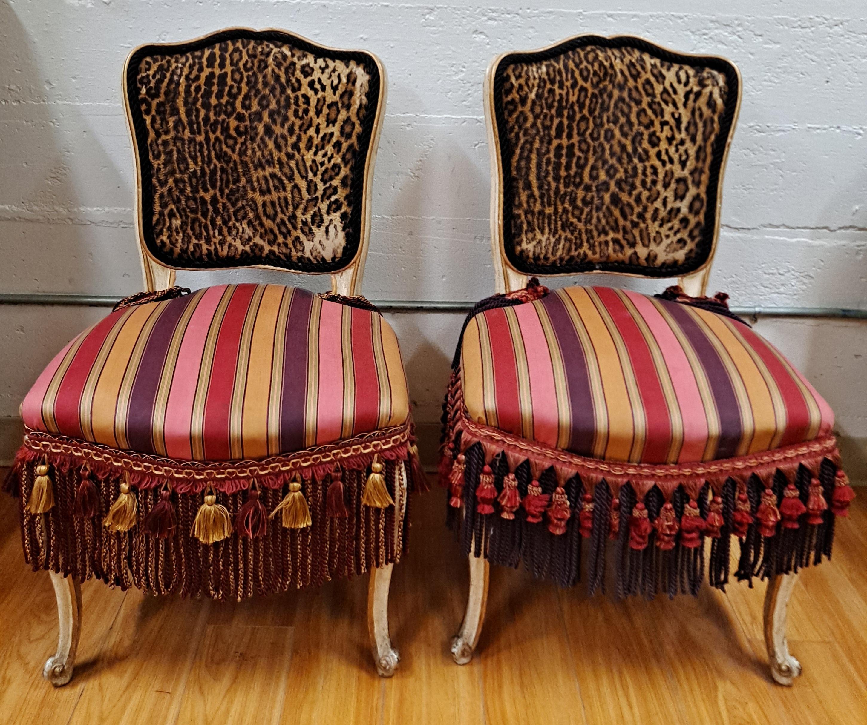 Pair of French Style Side Chairs

Custom leopard print upholstered backs and silk stripe upholstered seats with tassels

21