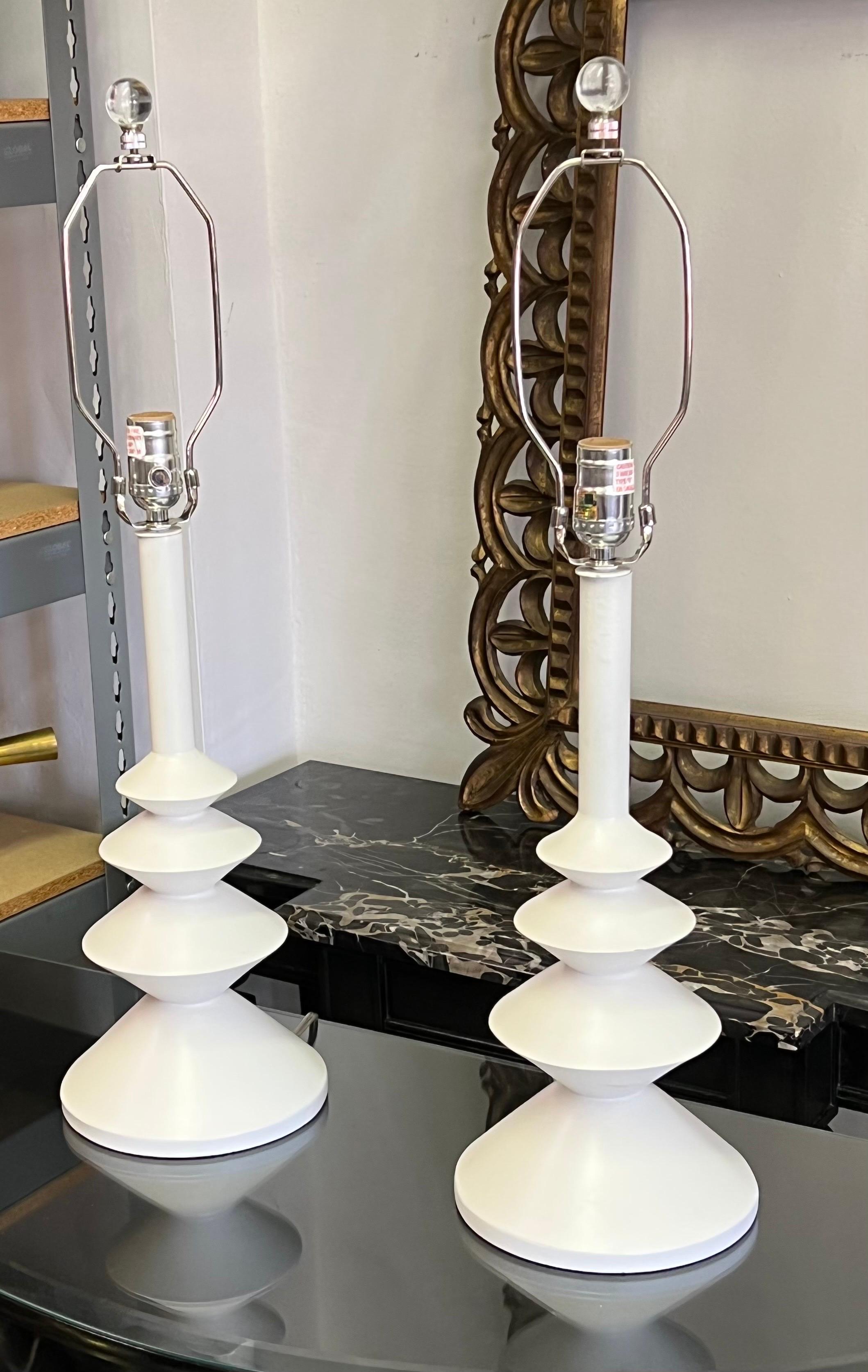 Elegant Pair of French style table lamps in the style of Alberto and Diego Giacometti, and Attributed to Sirmos. The pieces have a timeless columnar, cylindrical organic form that has an enchanting sensibility. 

Priced and Sold as a pair. The