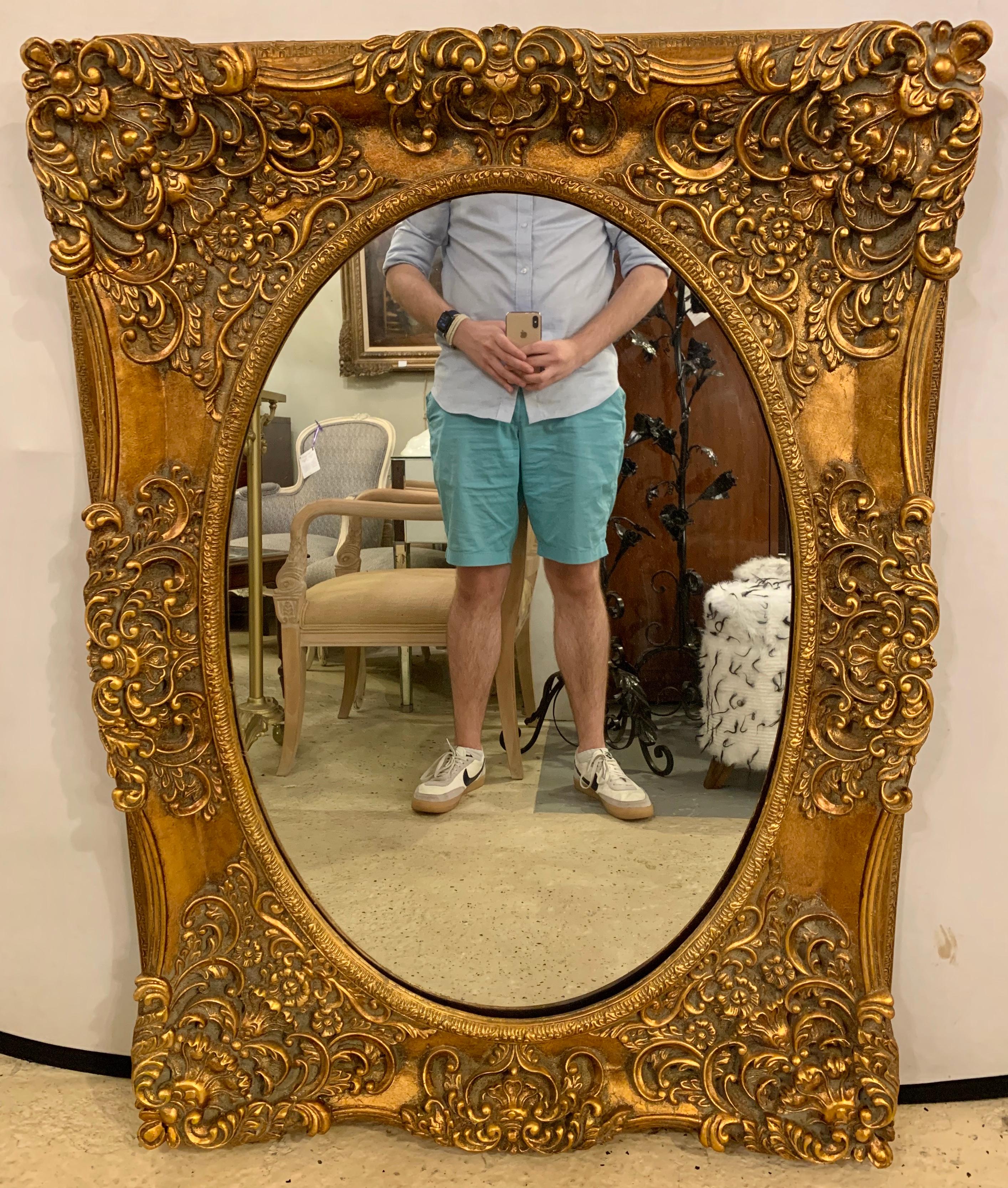 Pair of French Style Wall, Console or Pier Mirrors. Gilt Gesso and Wooden. These finely crafted oval mirrors set in a heavily carved wood and composition frame. 

Greg
1SXX/1XAX