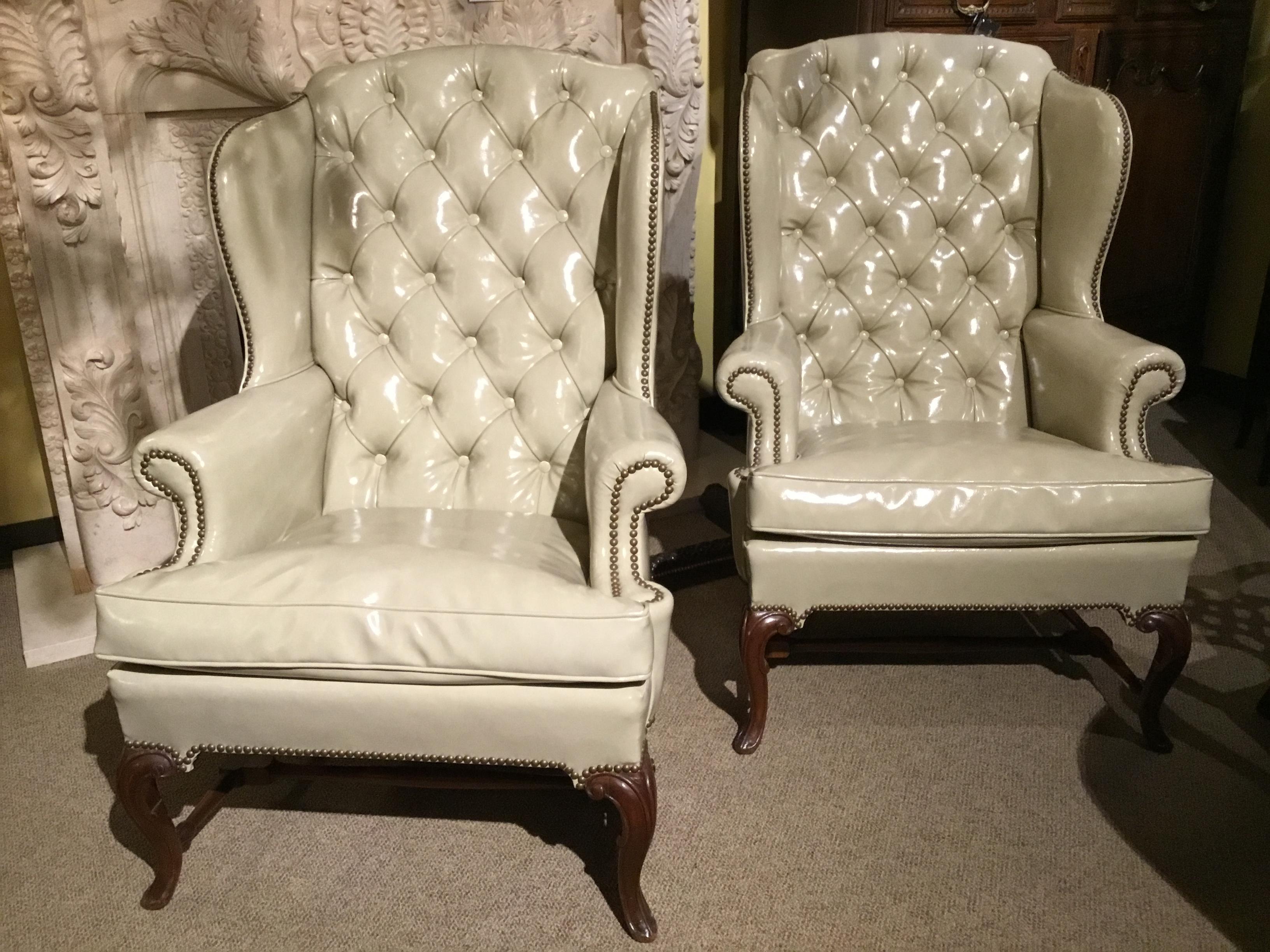 Early 20th century Each with a slightly domed and tufted back joined by shaped
Sides and out scrolled arms to the cushioned seat, raised on cabriole legs
Joined by an H-formed stretcher and ending in scrolled toes.