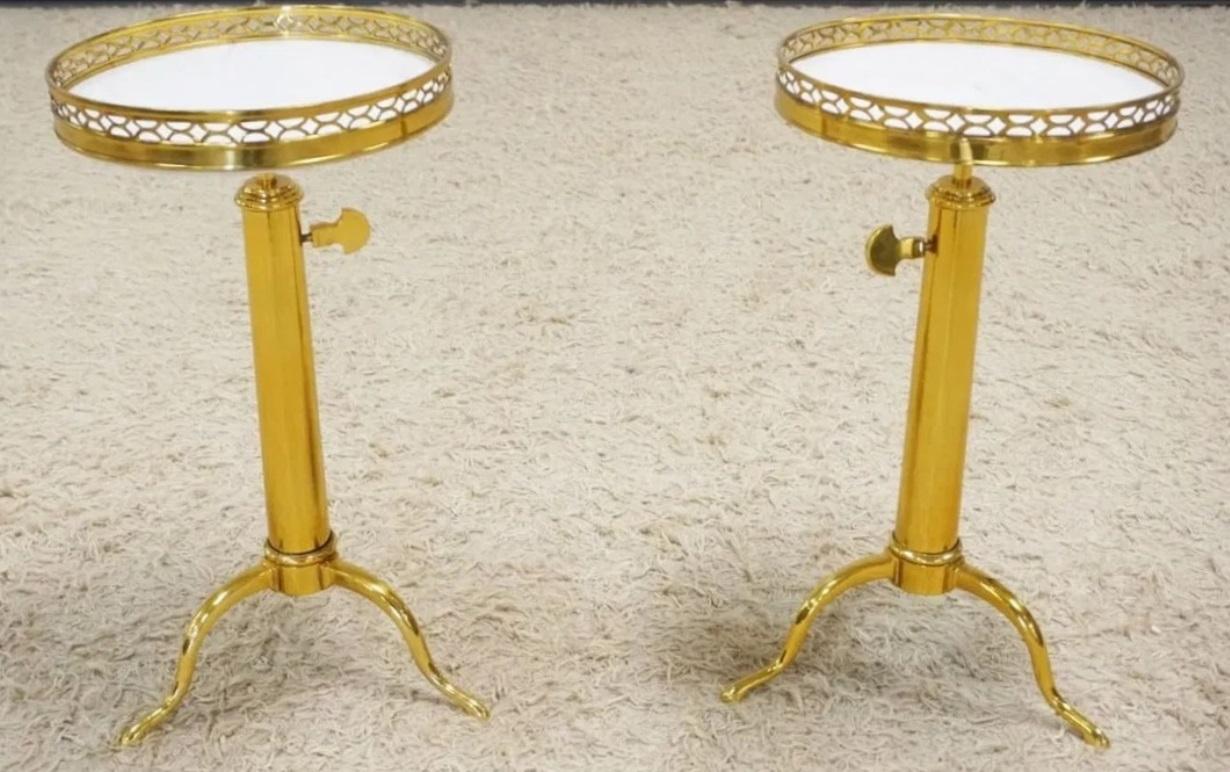 A pair of fine French gilt-brass telescoping occasional tables ,  with white round marble top and pierced gallery on an adjustable shaft with cabriole legs and pad feet,  model created by and attributed to Maison Toulouse.

Note ; The prestigious