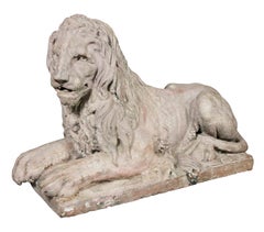 Pair of French Terracotta Figures of Crouching Lions