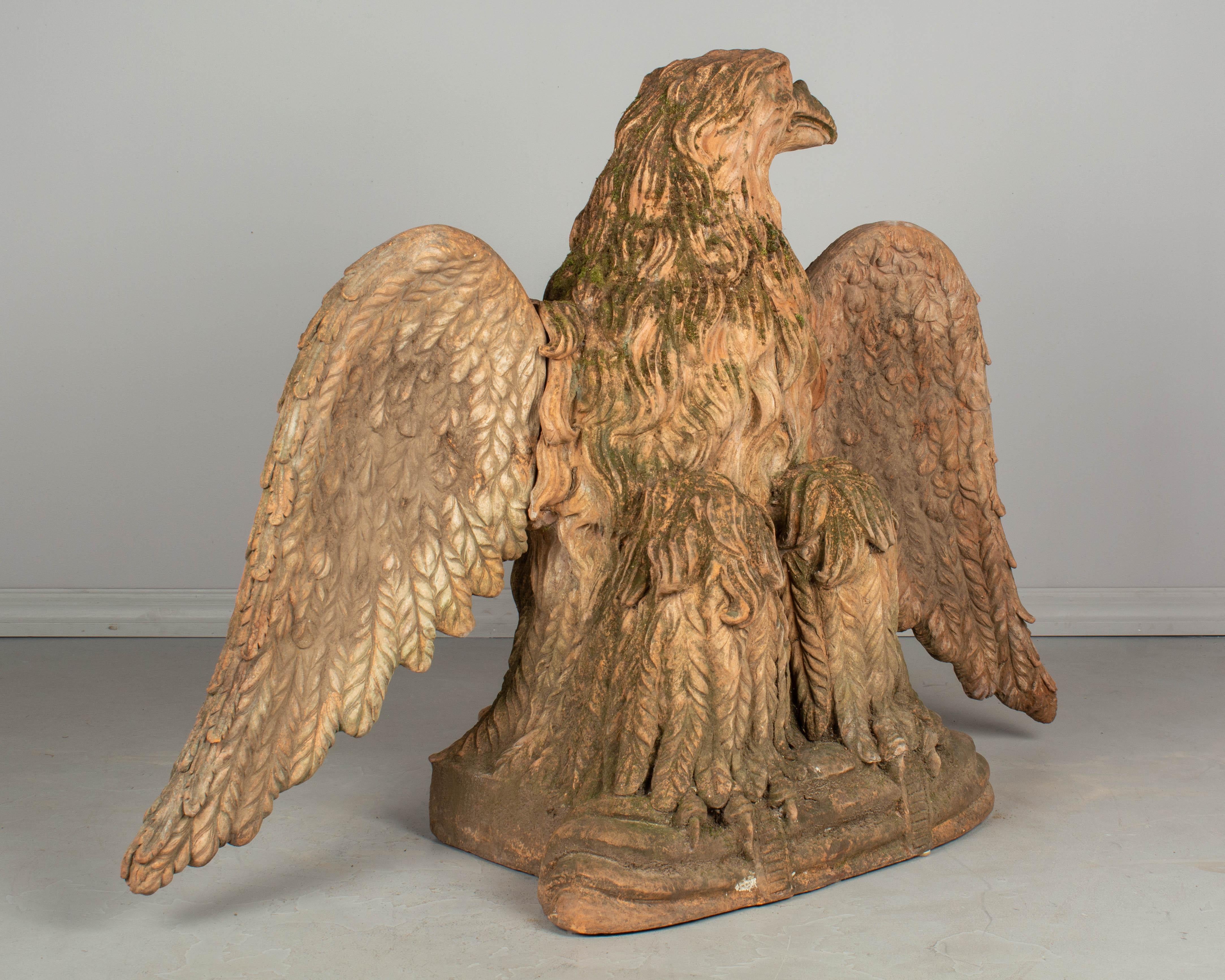 20th Century Pair of French Terracotta Garden Eagles Statues