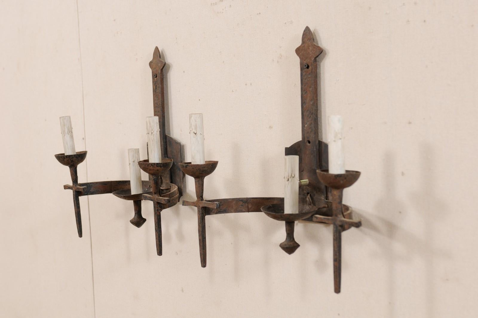 Pair of French Three-Light Midcentury Torch-Style Iron Sconces In Good Condition For Sale In Atlanta, GA