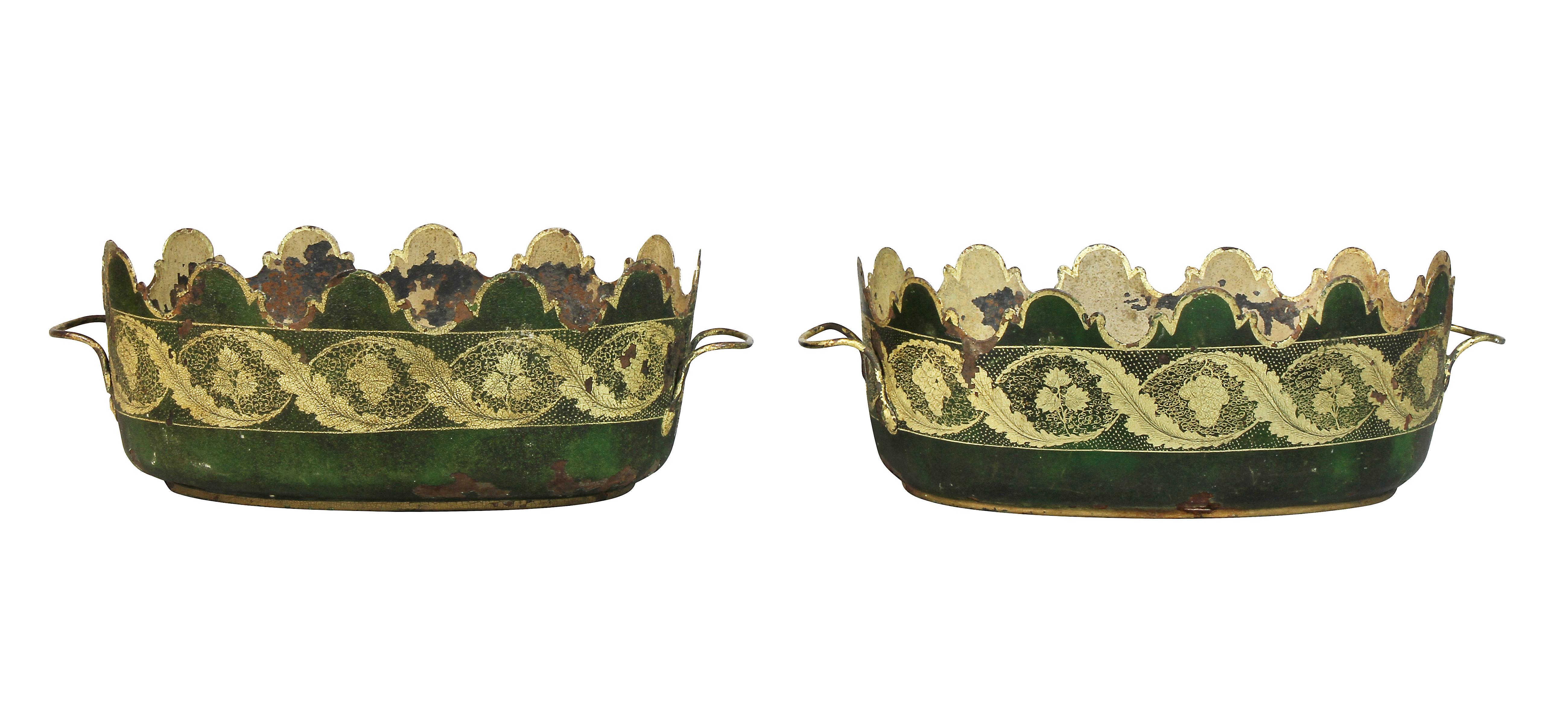 Each painted green with gilt rinceaux decoration. Oval form with loop handles.