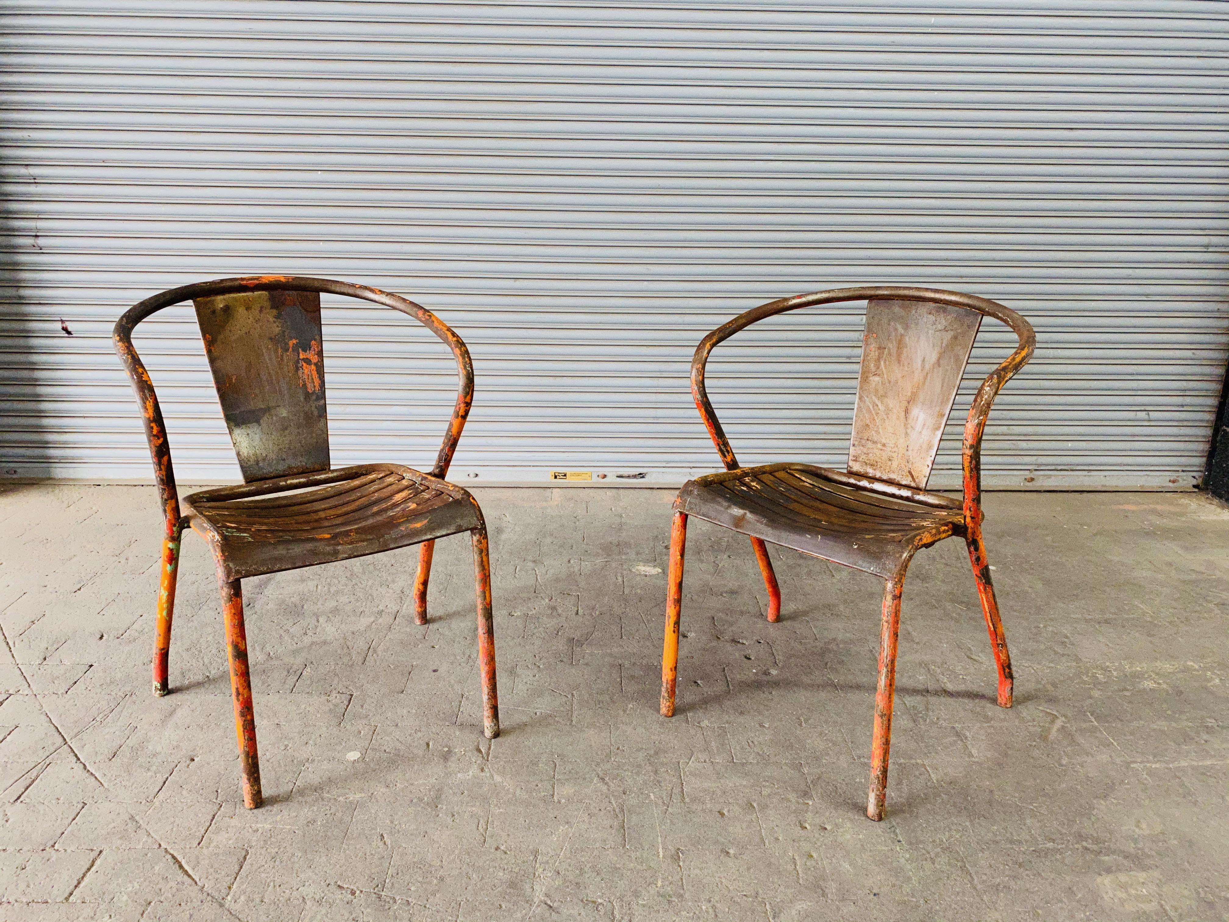 Iron Pair of French Tolix Industrial Chairs with Distressed Orange Paint Finish