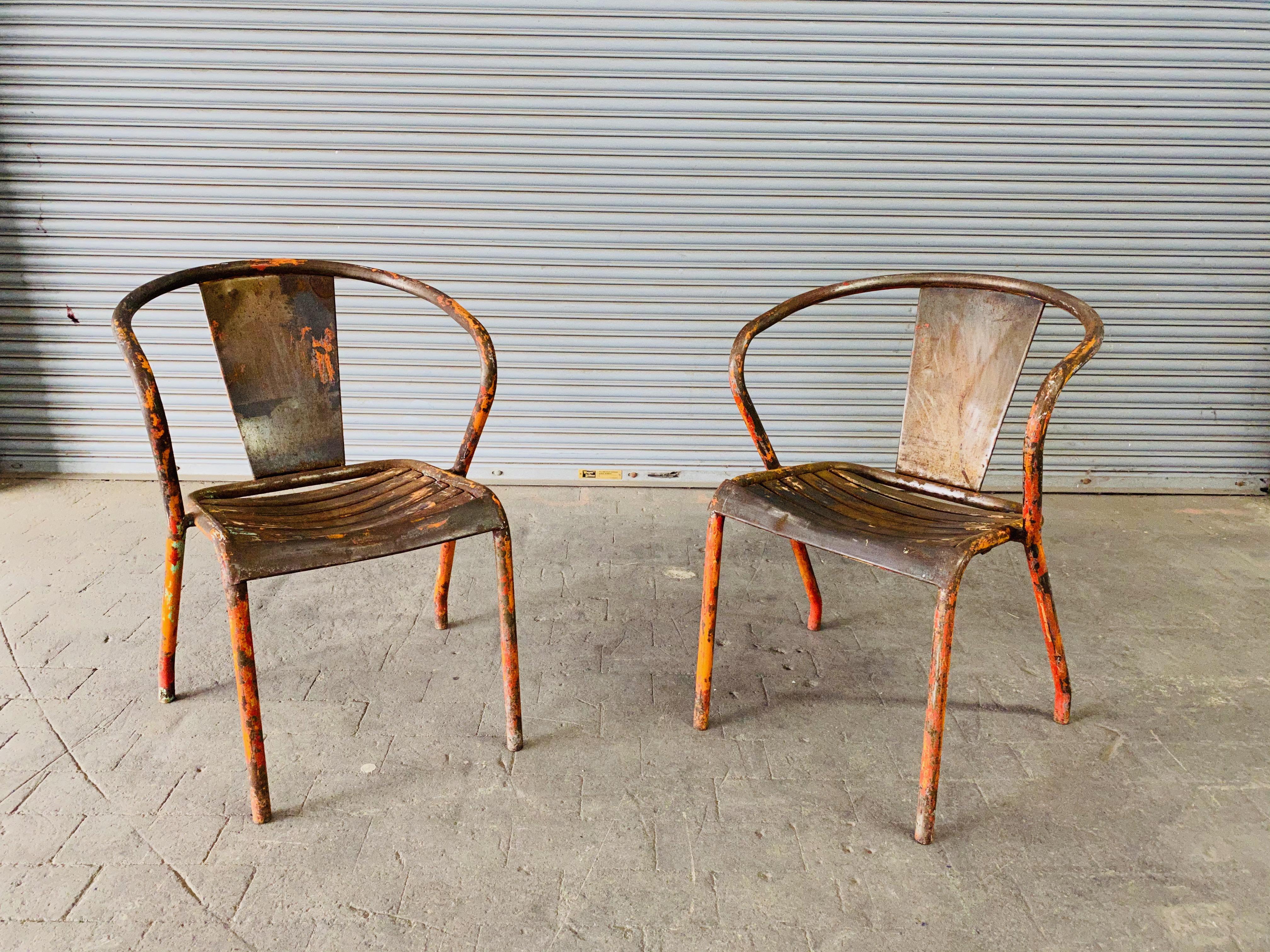 Pair of French Tolix Industrial Chairs with Distressed Orange Paint Finish In Distressed Condition In Buchanan, NY