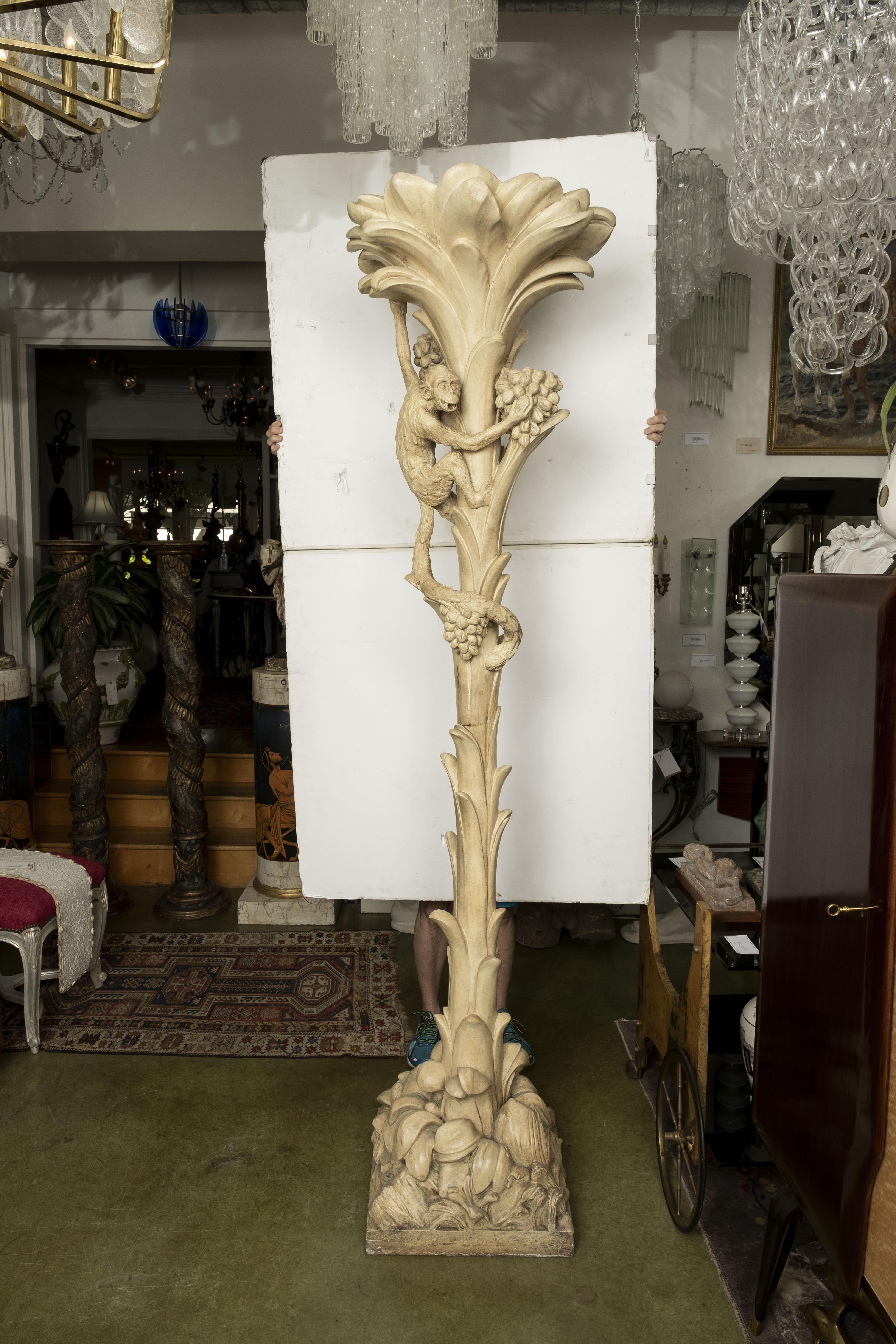 Pair of French Torchieres or floor lamps with monkeys attributed to Serge Roche. This stunning pair of heavy weight french palm tree Torchères with a monkey and three separate lights each plus a lighted top. These tall French palm tree floor lamps