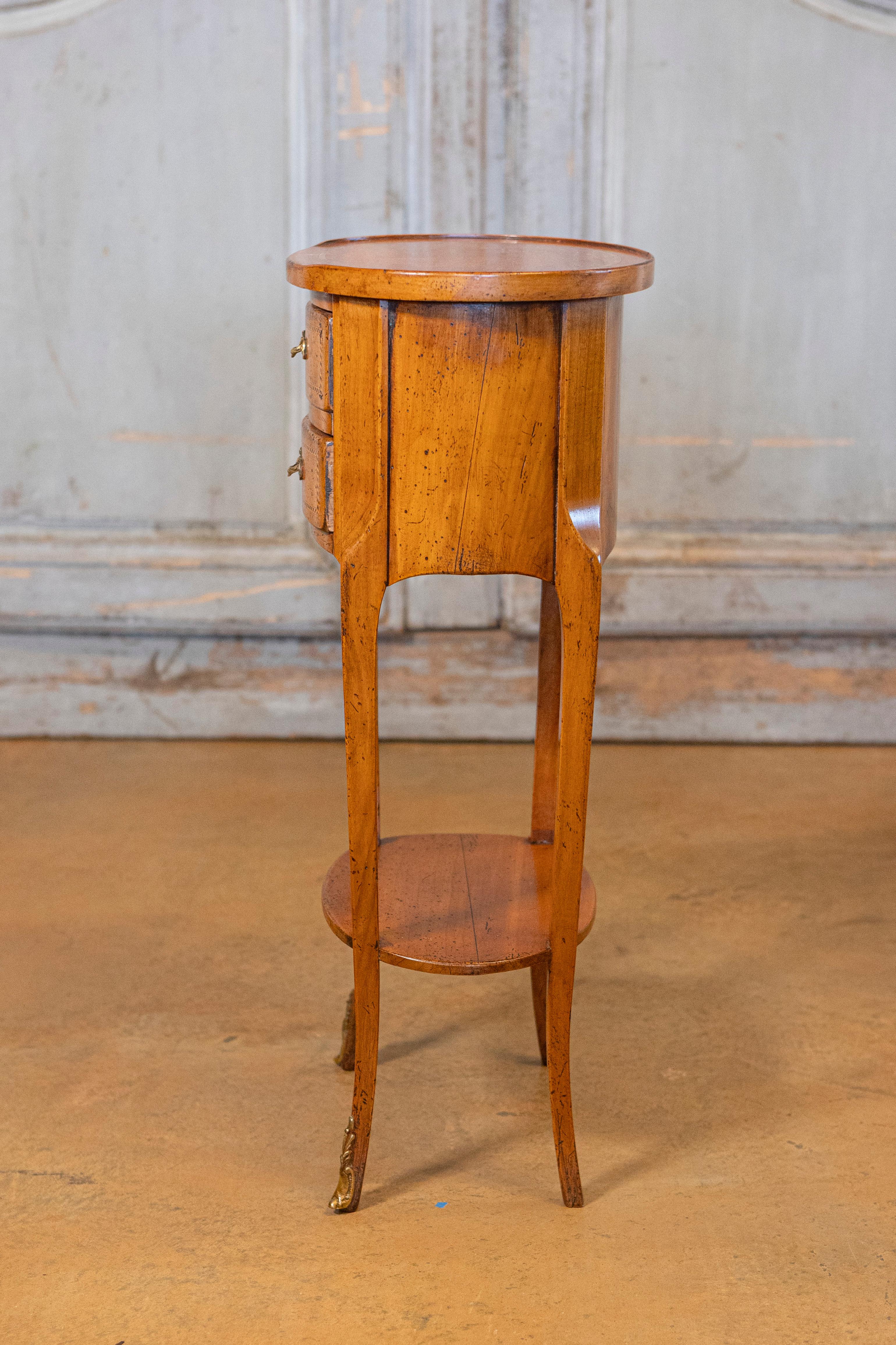 Bronze Pair of French Transition Style Oval-Shaped Fruitwood Bedside Tables with Inlay For Sale