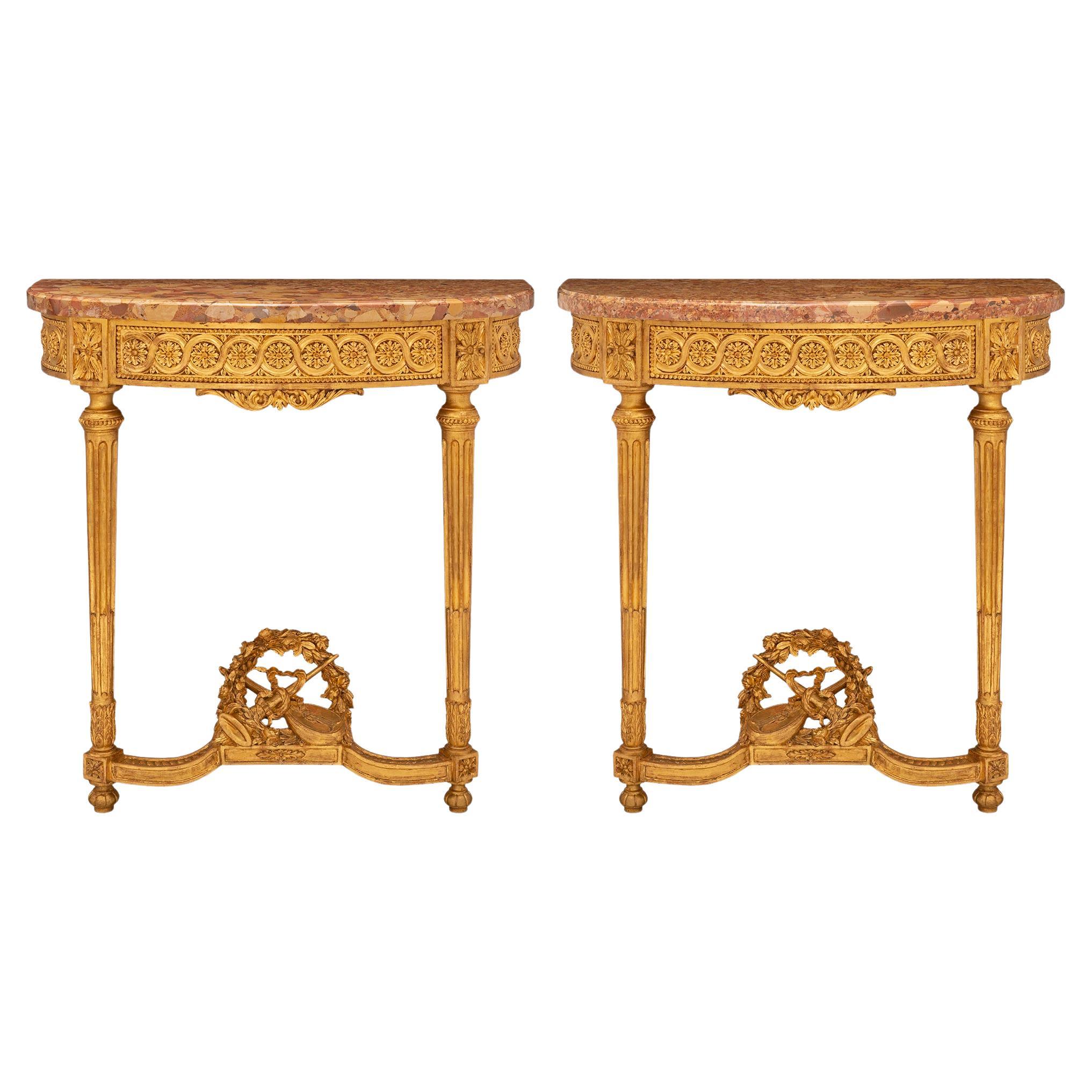 Pair of French Turn-of-the-Century Louis XVI St. Giltwood and Marble Consoles For Sale