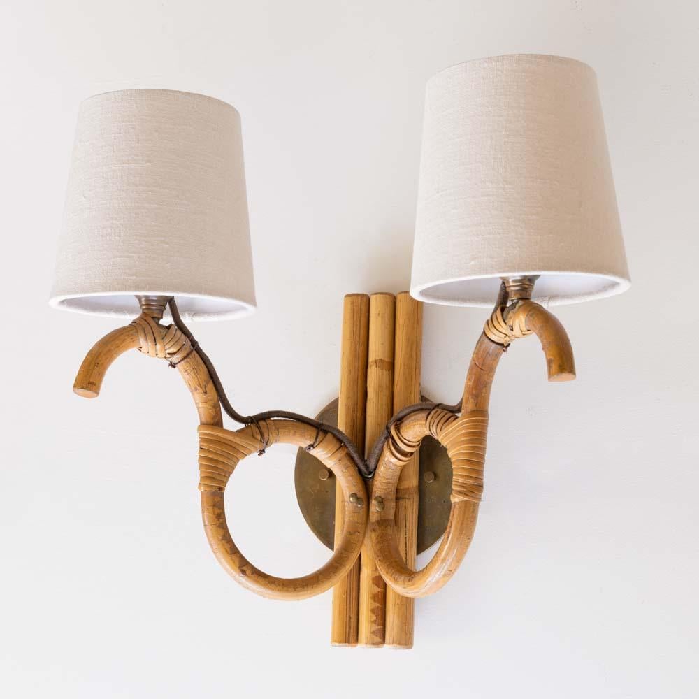 Linen Pair of French Two-Arm Rattan Sconces For Sale
