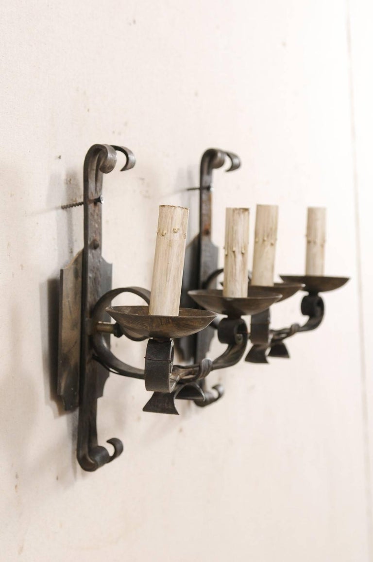 Pair of French TwoLight Iron Sconces with Scrolled Arms