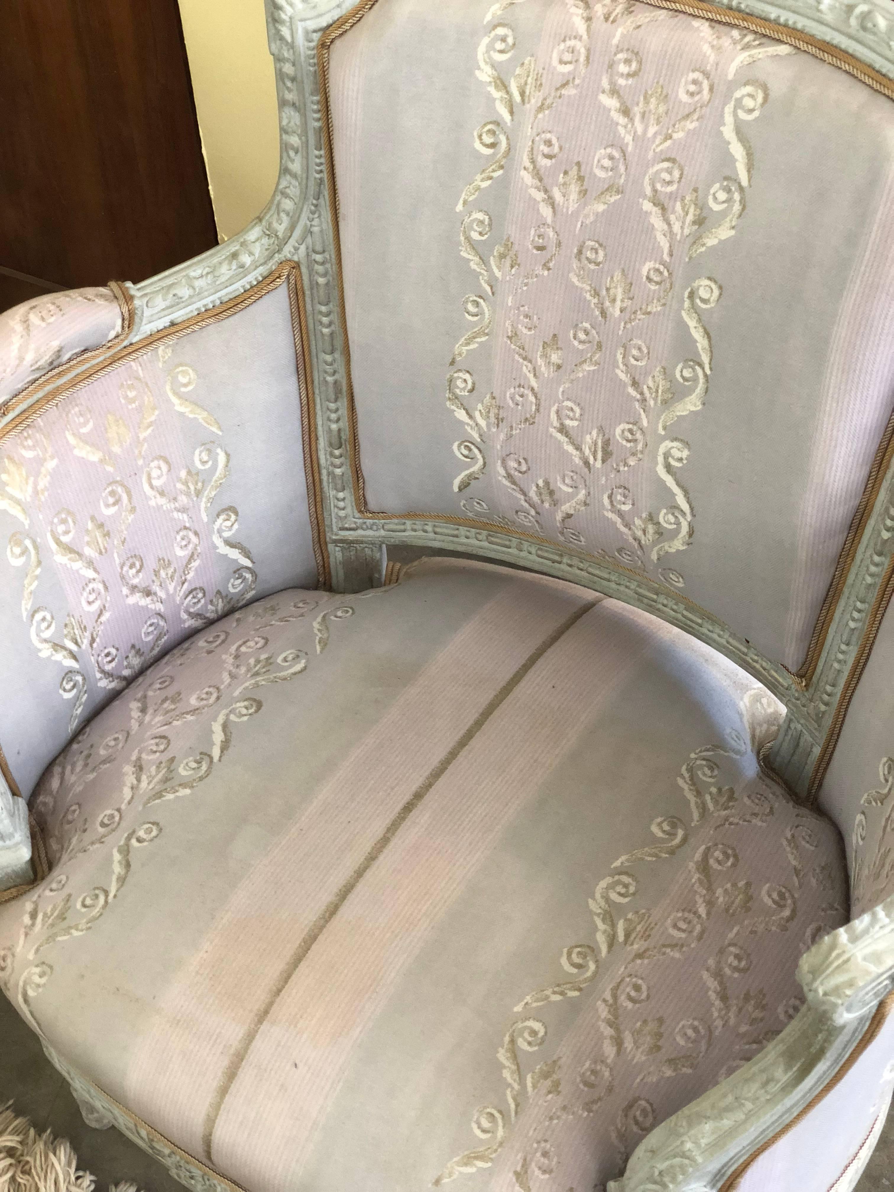 Pair of French upholstered armchairs.