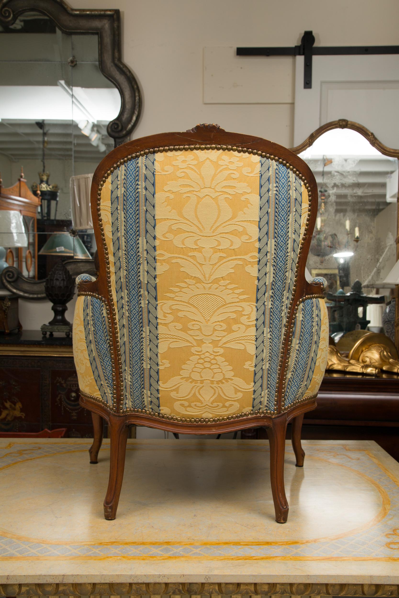 Hand-Carved Pair of French Upholstered Bergere Chairs