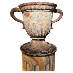 Pair of french vases in blue-grey cast iron with dolphin handles