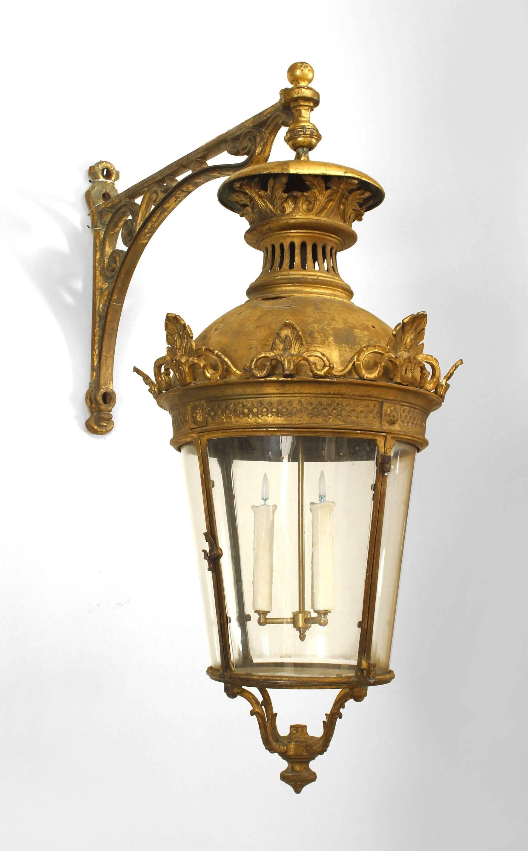 Pair of French Victorian bronze 4 sided bent glass paneled lanterns with scroll bracket wall support (PRICED AS Pair).
