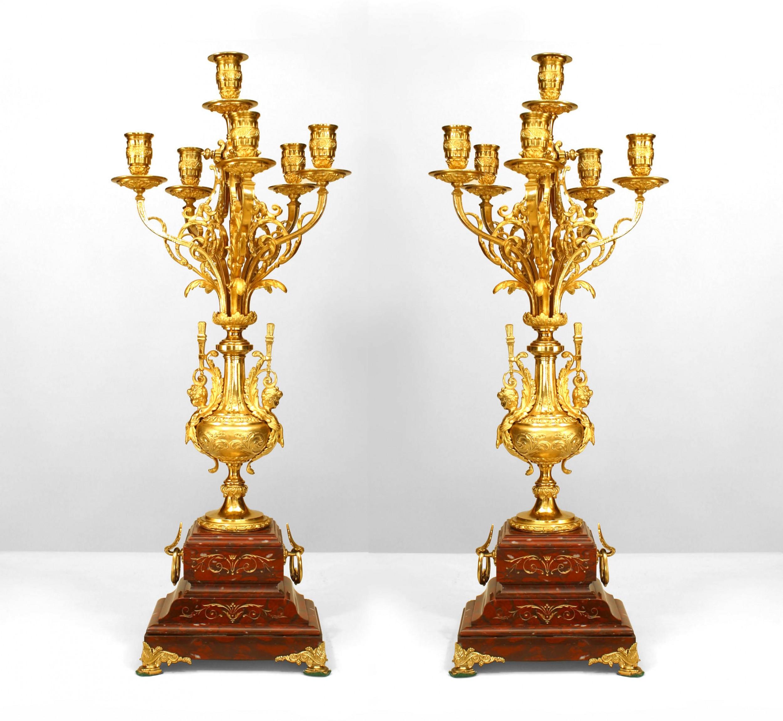 PAIR of French Victorian rouge marble and gilt bronze 6 arm candelabra with a gilt bronze urn over a tiered base (PRICED AS PAIR).