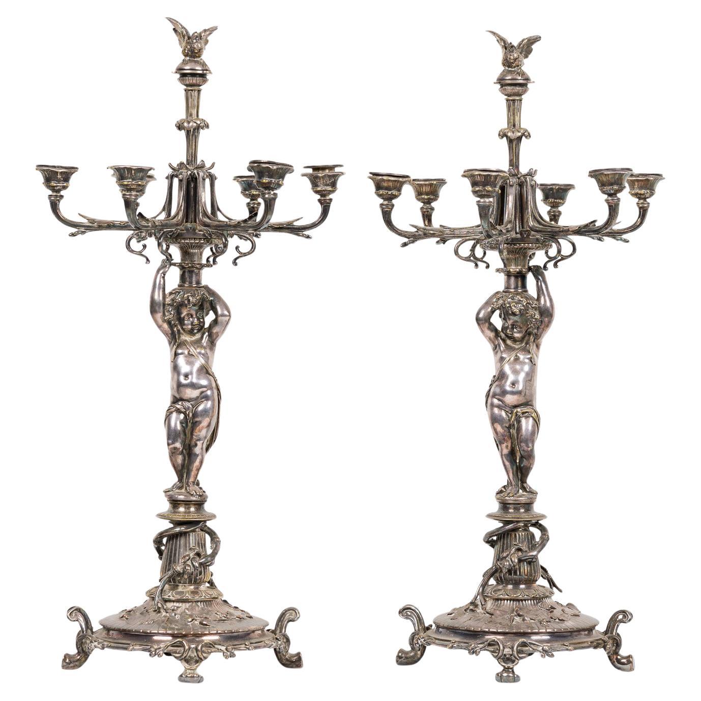 Paire de candélabres Cupidon en métal argenté de l'époque victorienne française