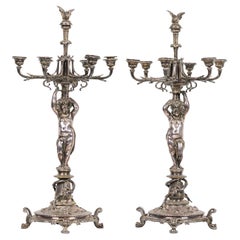 Pareja de candelabros cupidos victorianos franceses bañados en plata