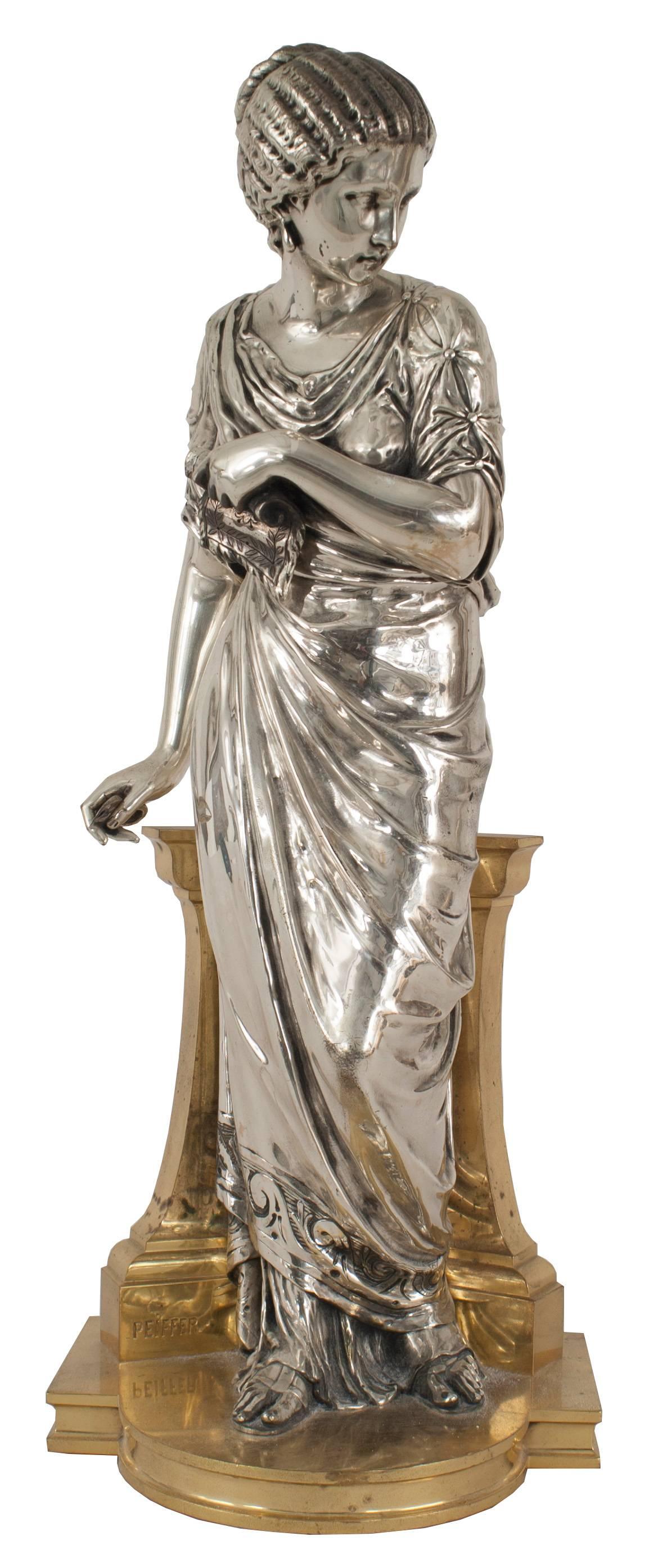 Pair of French Victorian silvered and gilt bronze classical Greek female figures after models by Joseph Peiffer (retailed and stamped TIFFANY & CO./NEW YORK).
   