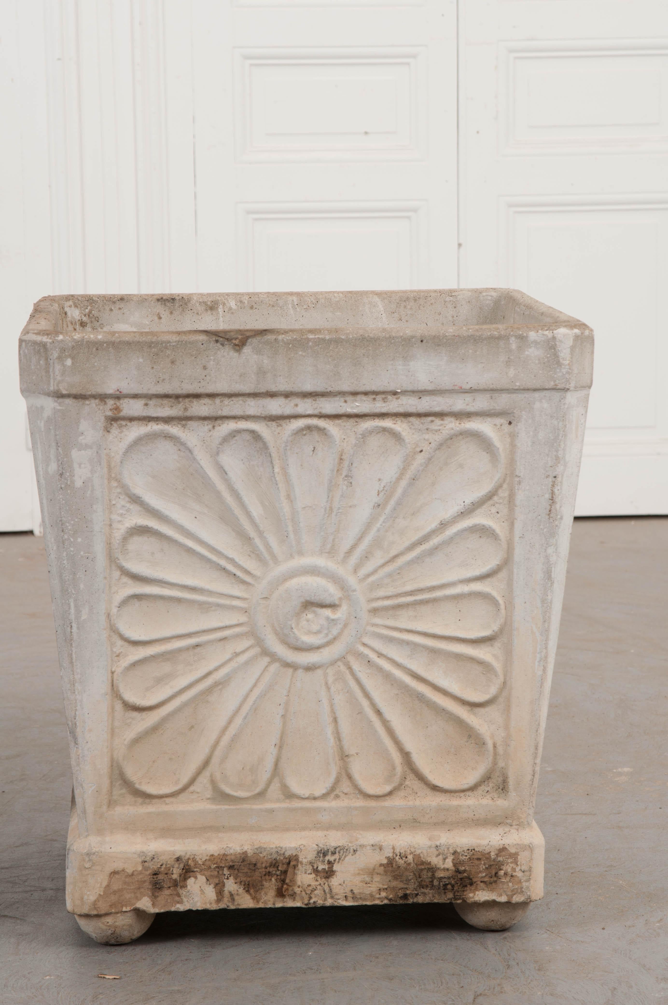 This delightful pair of vintage concrete planters, circa 1920, are from France. Of square section, each side features a single large blossom. The unique planters would look fantastic on a veranda or flanking an entrance.