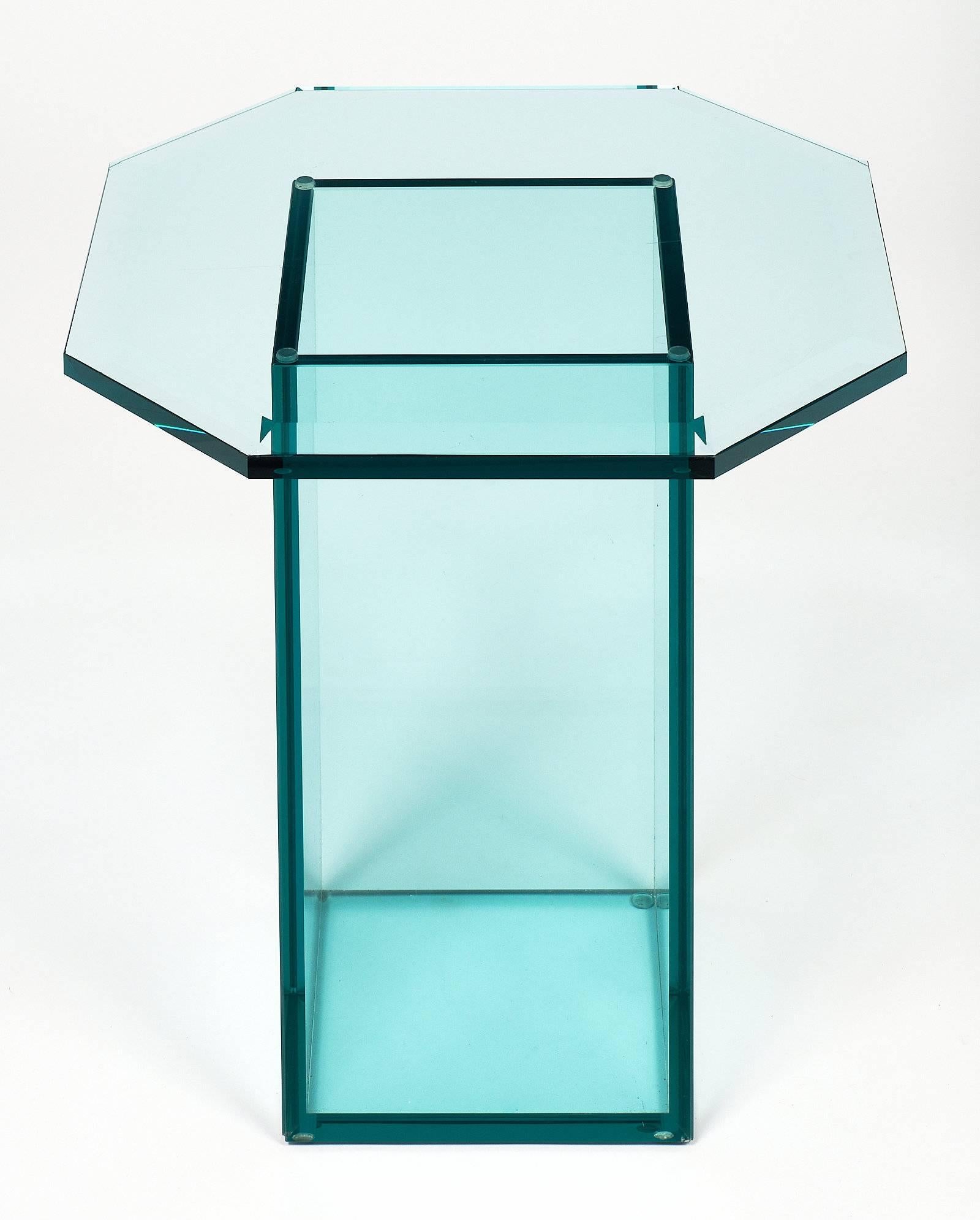 French vintage set of glass side tables with green tinted glass. They have a rectangular base and a bevelled octagonal top. They create a strong design with an airy look.