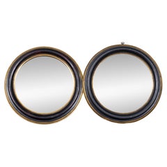 Pair of French Vintage Round Ebonized and Giltwood Mirrors