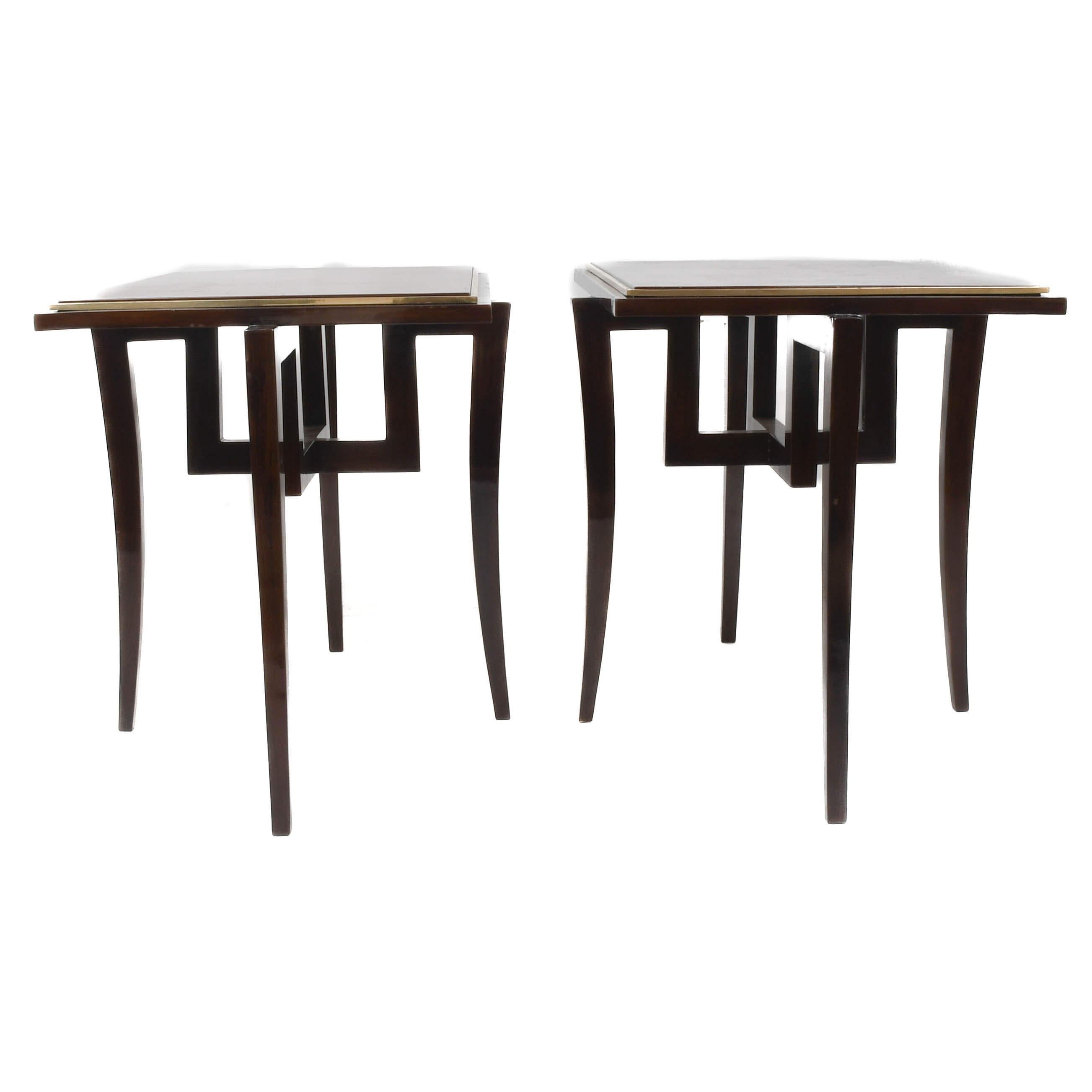 This Pair of French Walnut Art Deco-Style Side Tables offers the perfect balance between vintage charm and sleek sophistication. With rich walnut veneers framed by clean brass trim, each table showcases a warm, glowing surface that speaks to the